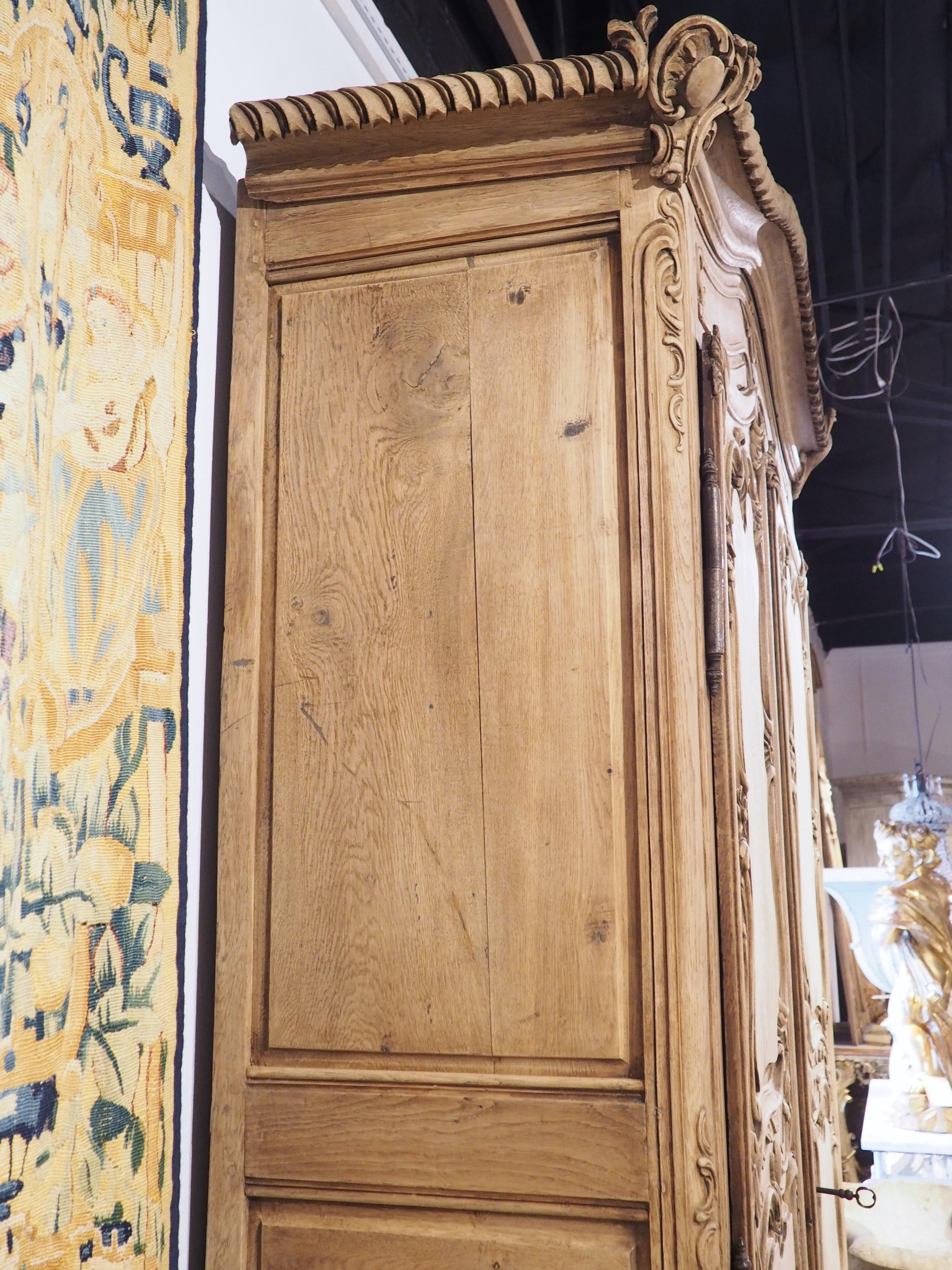 Tall and Narrow Early 1800s Bleached French Armoire in Carved and Pegged Oak 6