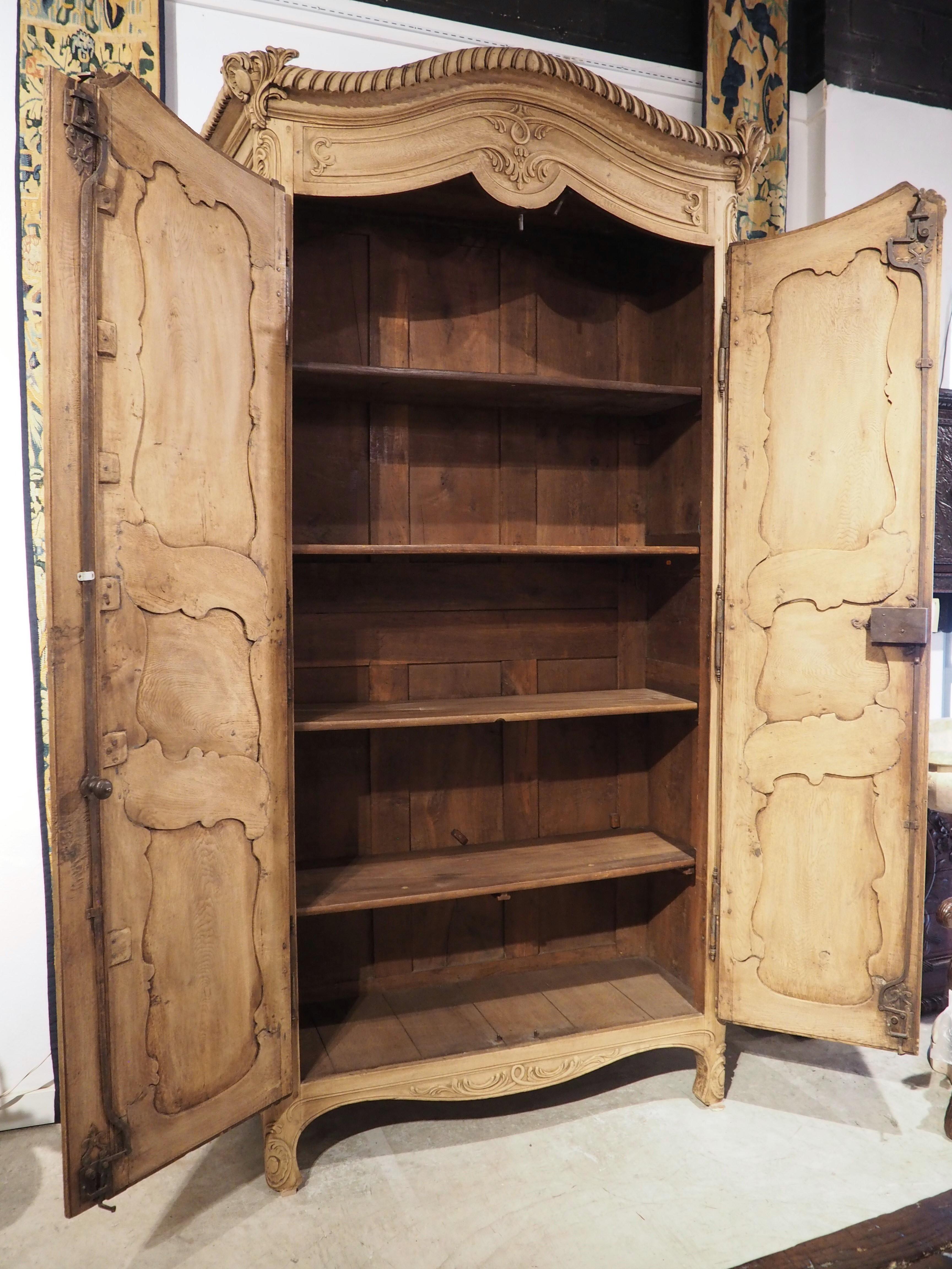 Tall and Narrow Early 1800s Bleached French Armoire in Carved and Pegged Oak 10