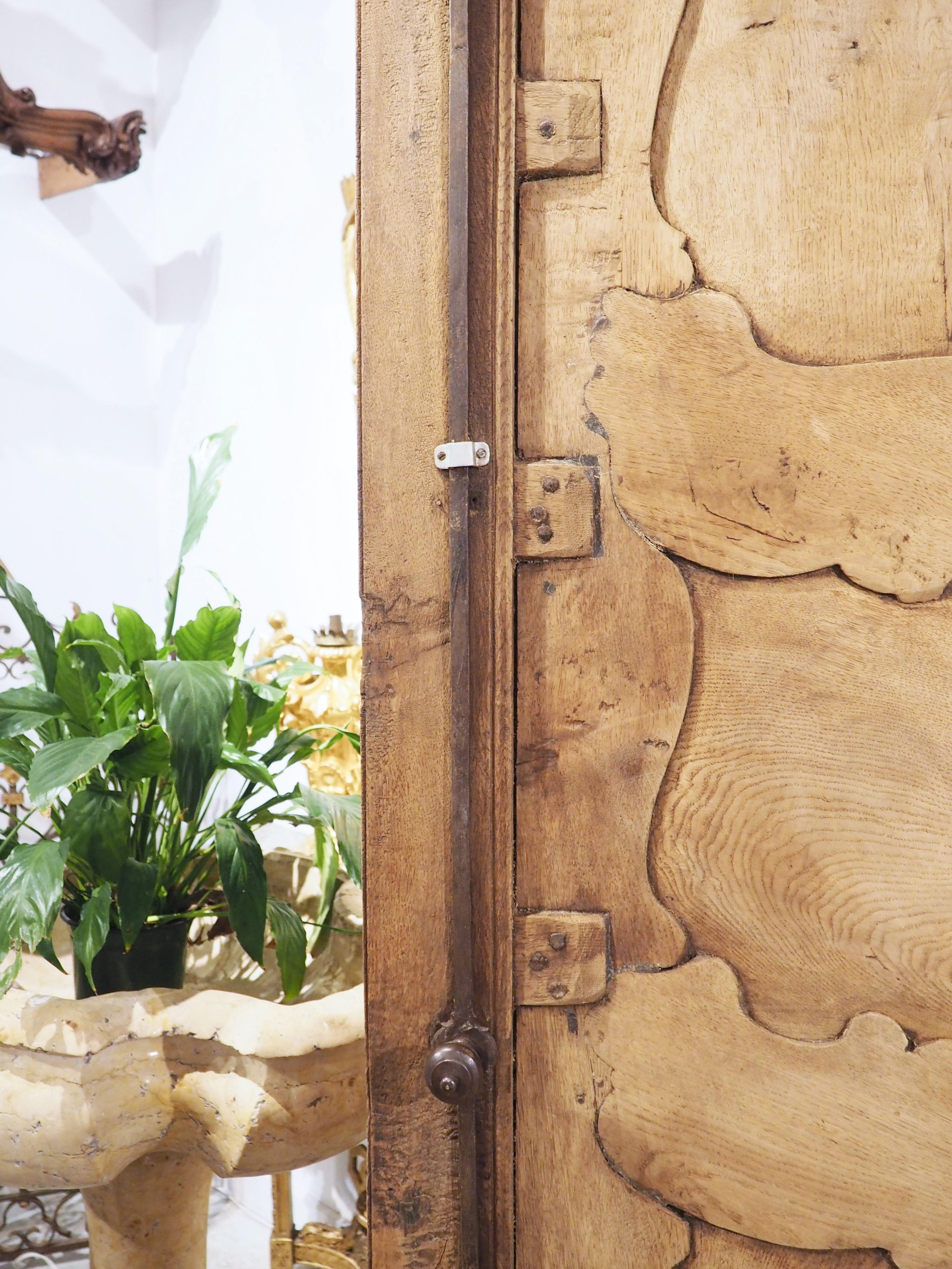 Tall and Narrow Early 1800s Bleached French Armoire in Carved and Pegged Oak 11