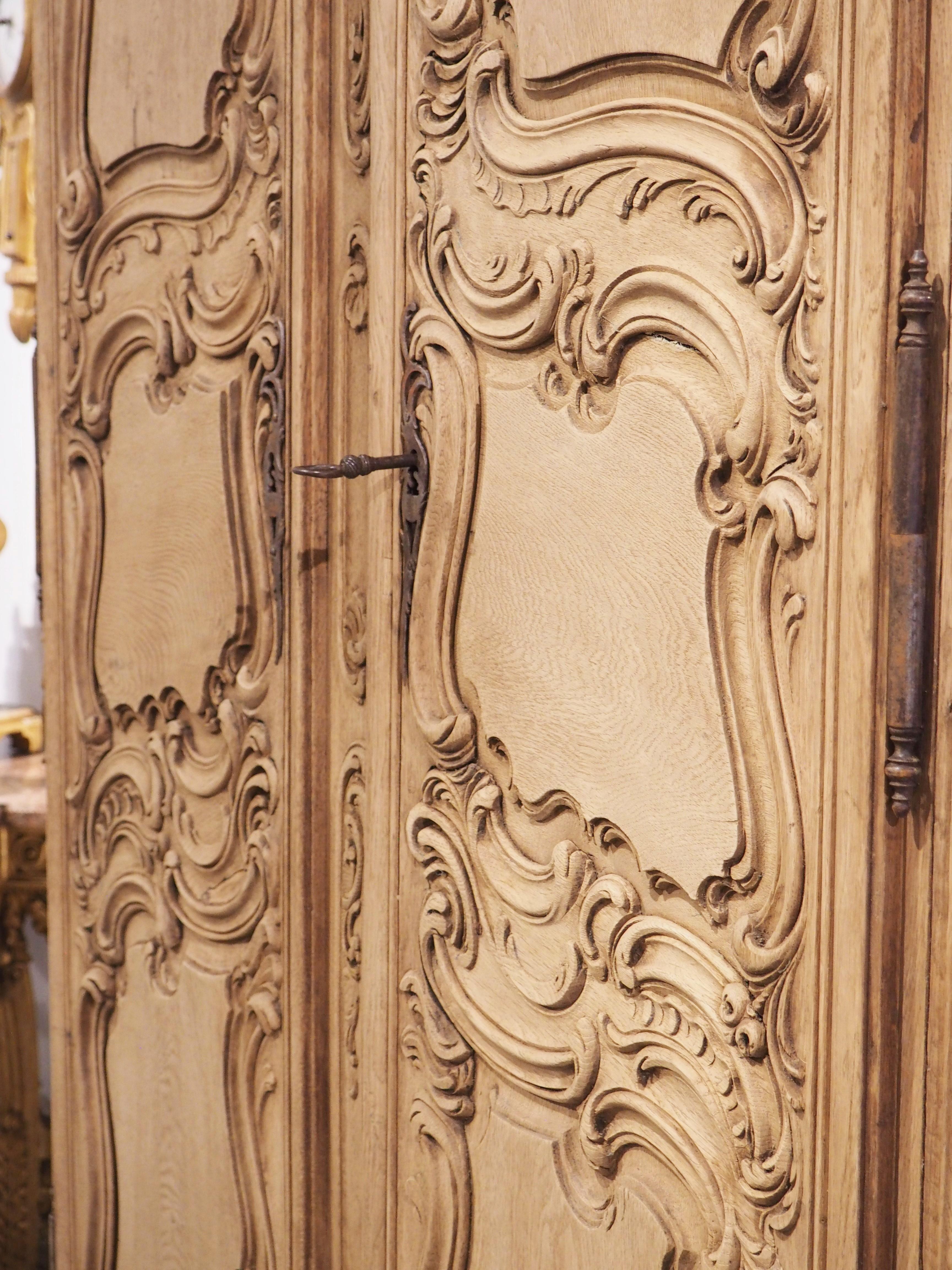 Tall and Narrow Early 1800s Bleached French Armoire in Carved and Pegged Oak 14