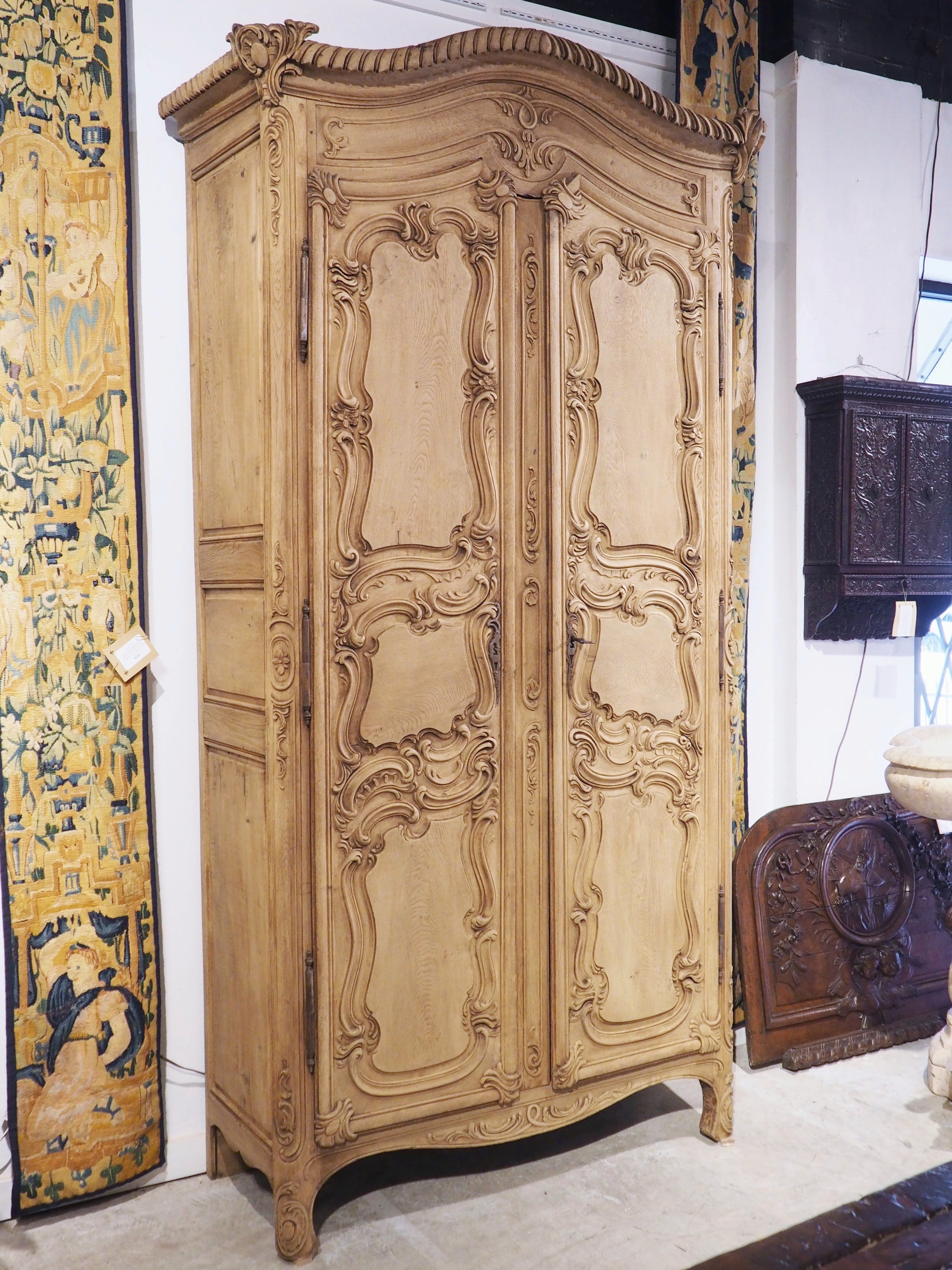 a-tall-and-narrow-early-1800s-bleached-french-armoire-in-carved-and