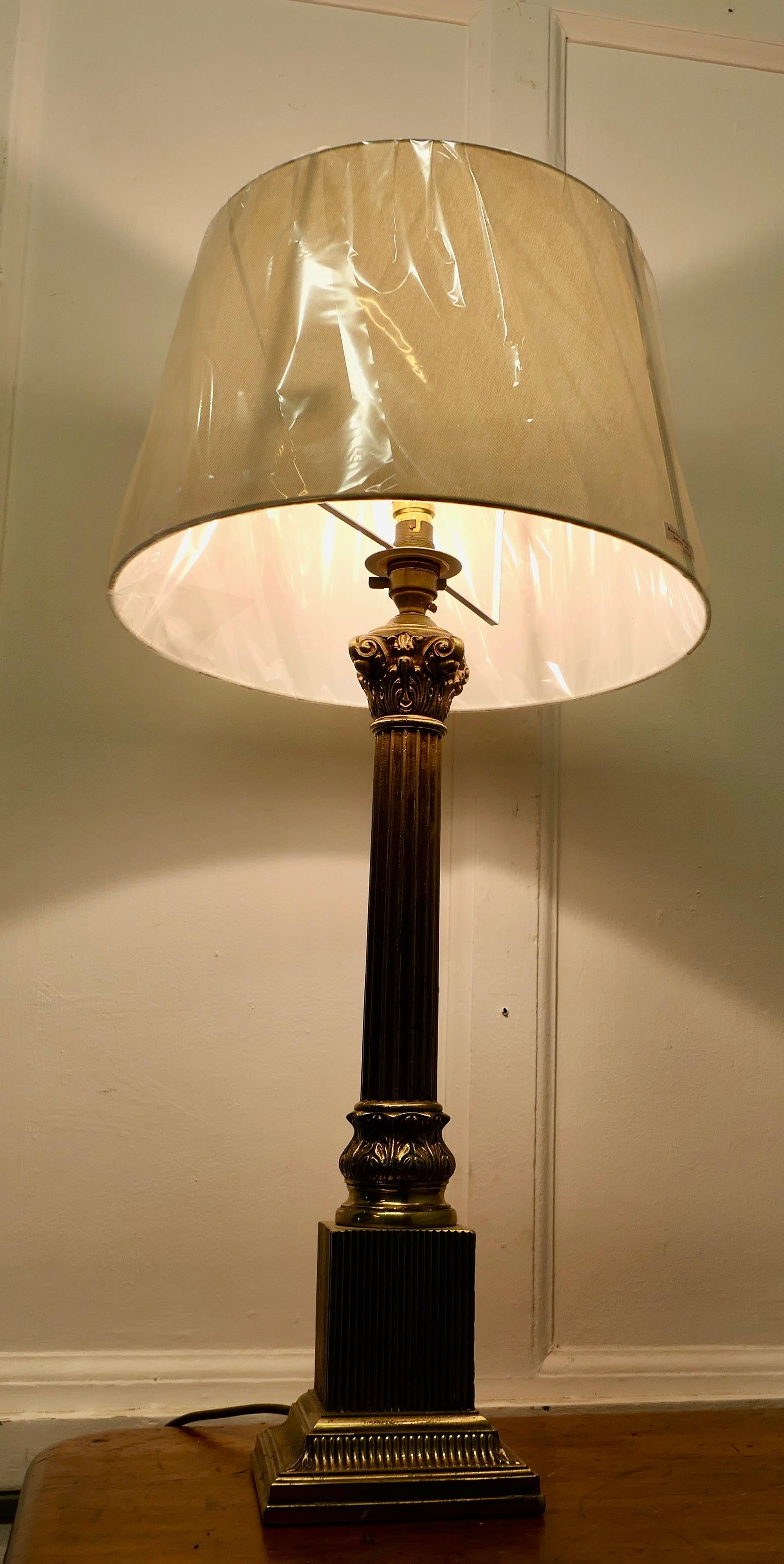 Neoclassical A Tall Brass Corinthian Column Table Lamp      For Sale