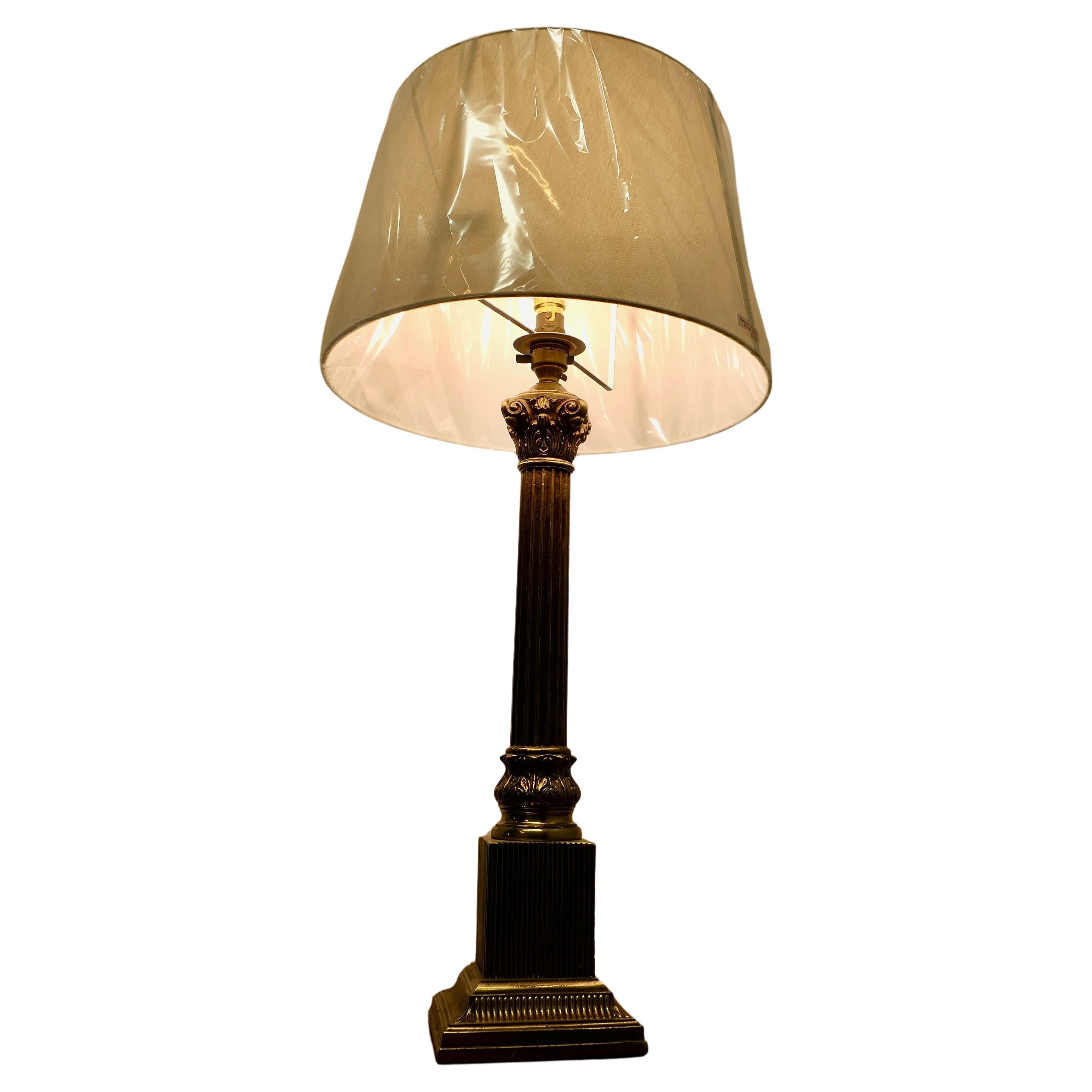 A Tall Brass Corinthian Column Table Lamp      For Sale