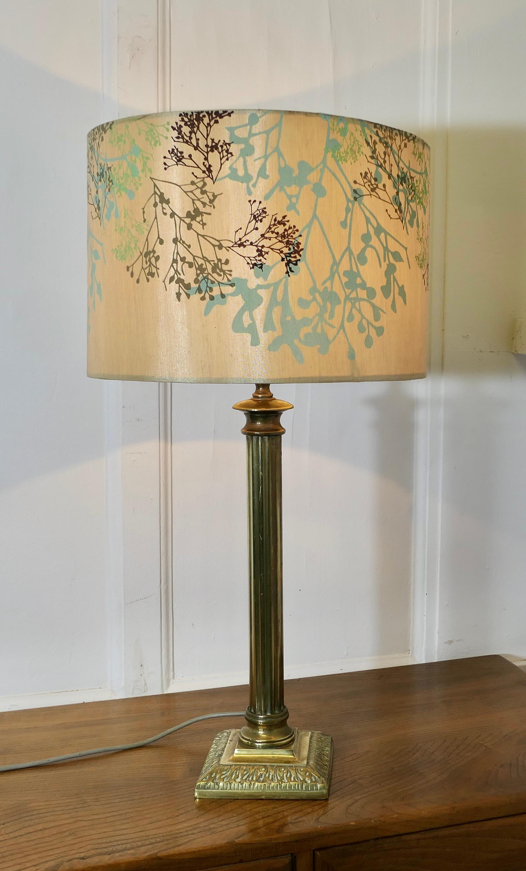 A Tall Brass Corinthian Column Table Lamp with Shade

This is a very attractive lamp it has a heavy single corinthian style column set on a stepped rectangular base, it comes with a neutral coloured linen lamp shade, this can be included if