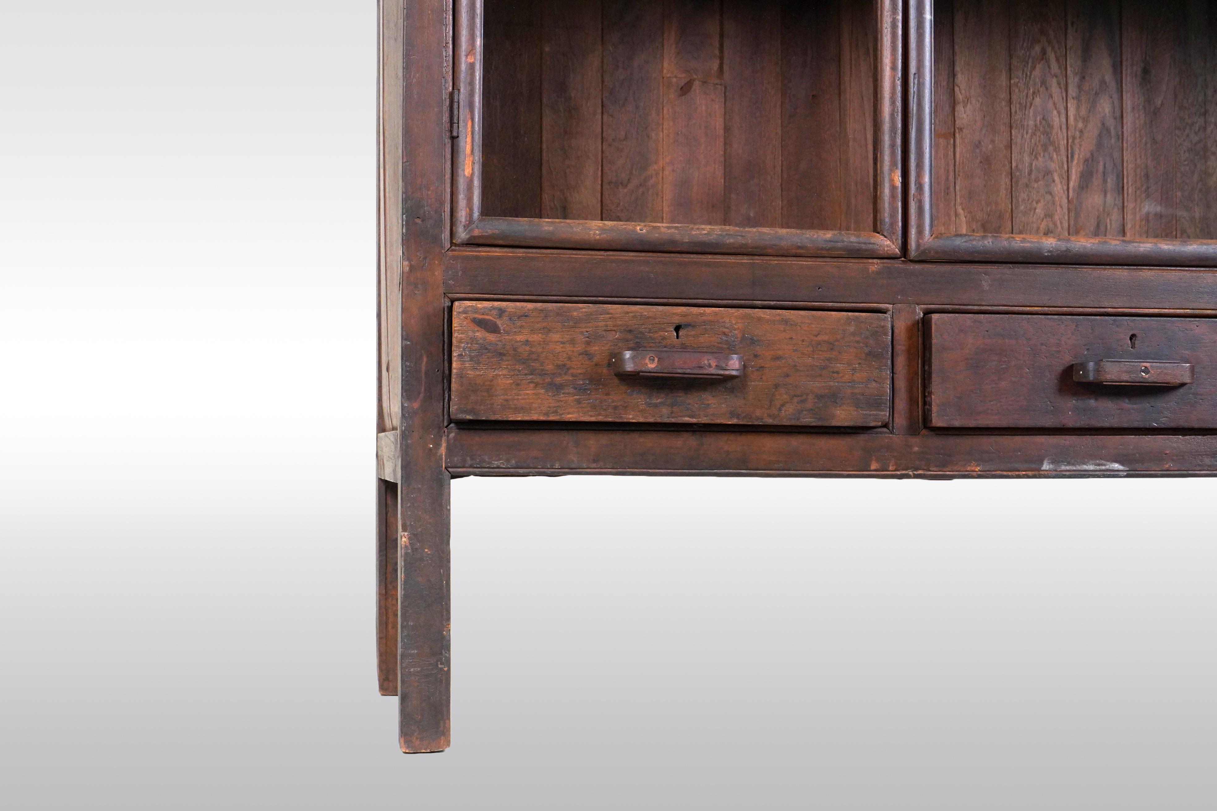 A Tall British Colonial Bookcase 4