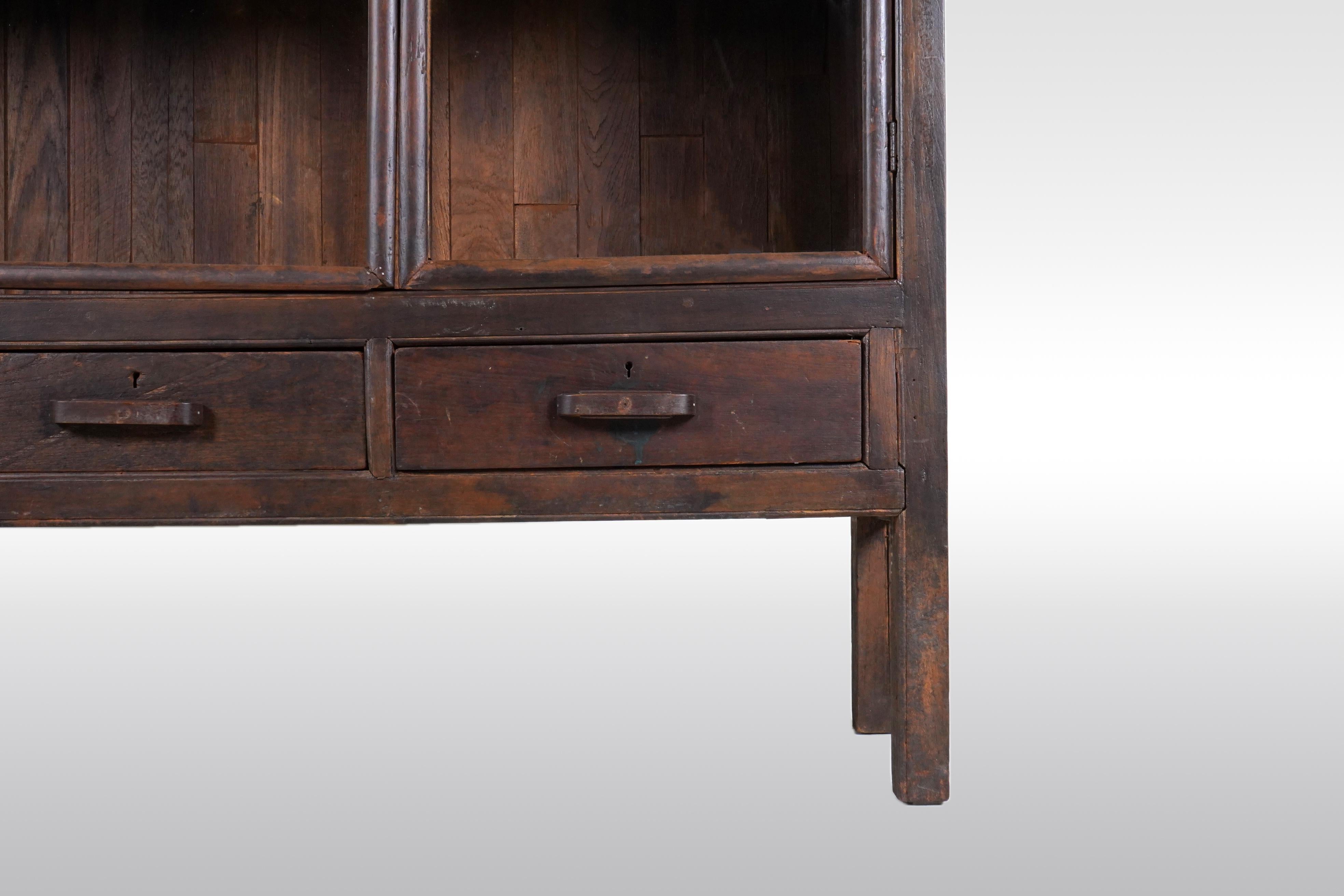 A Tall British Colonial Bookcase 3