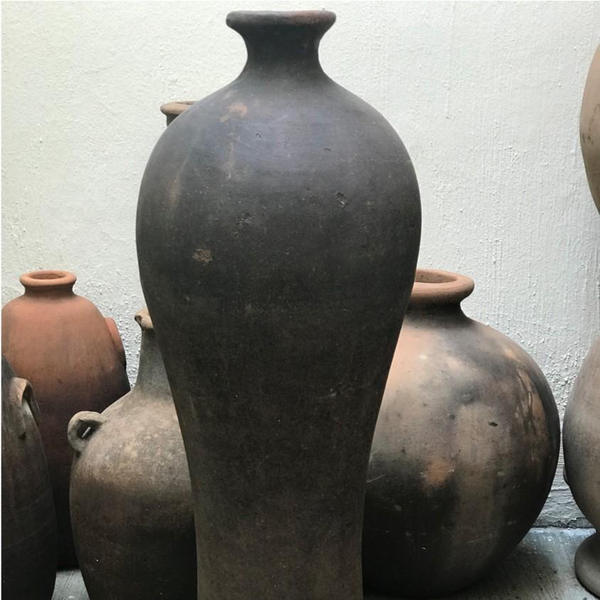 Joaquin is a tall vintage terracotta vessel discovered in a potters studio in the region of Jalisco, Mexico. The dark tones and aging of this piece makes for a great a garden piece, entrance piece or decorative interior accessory.