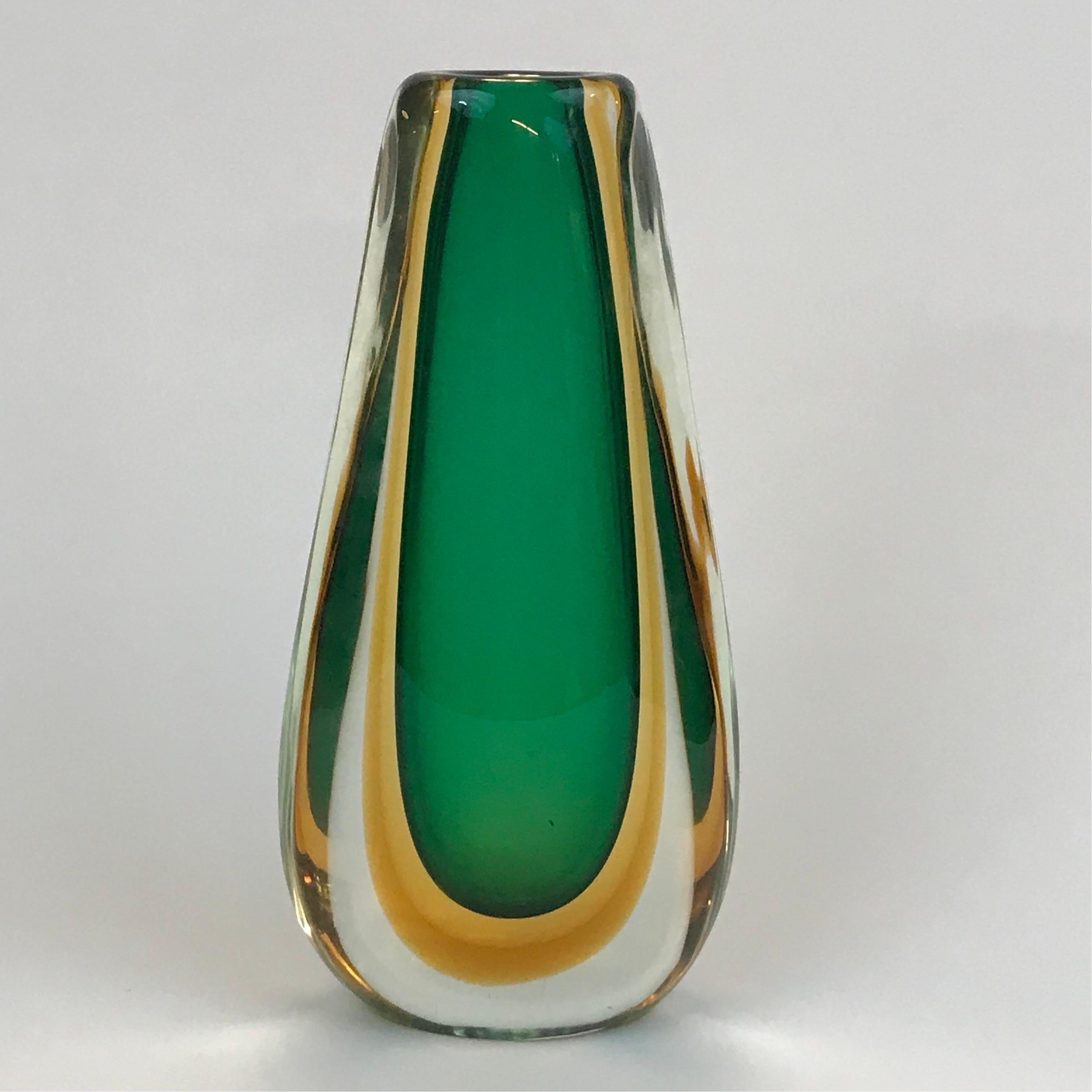 A large and heavy Sommerso technique vase by Flavio Poli for Seguso in clear amber and green glass. In overall excellent condition without chips cracks abrasions to the base, defects or sick glass. Shows one scratch at the base as shown in the
