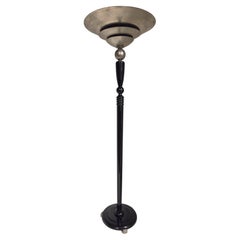 A tall French Art Deco tiered torchere /floor lamp in ebonized wood and metal