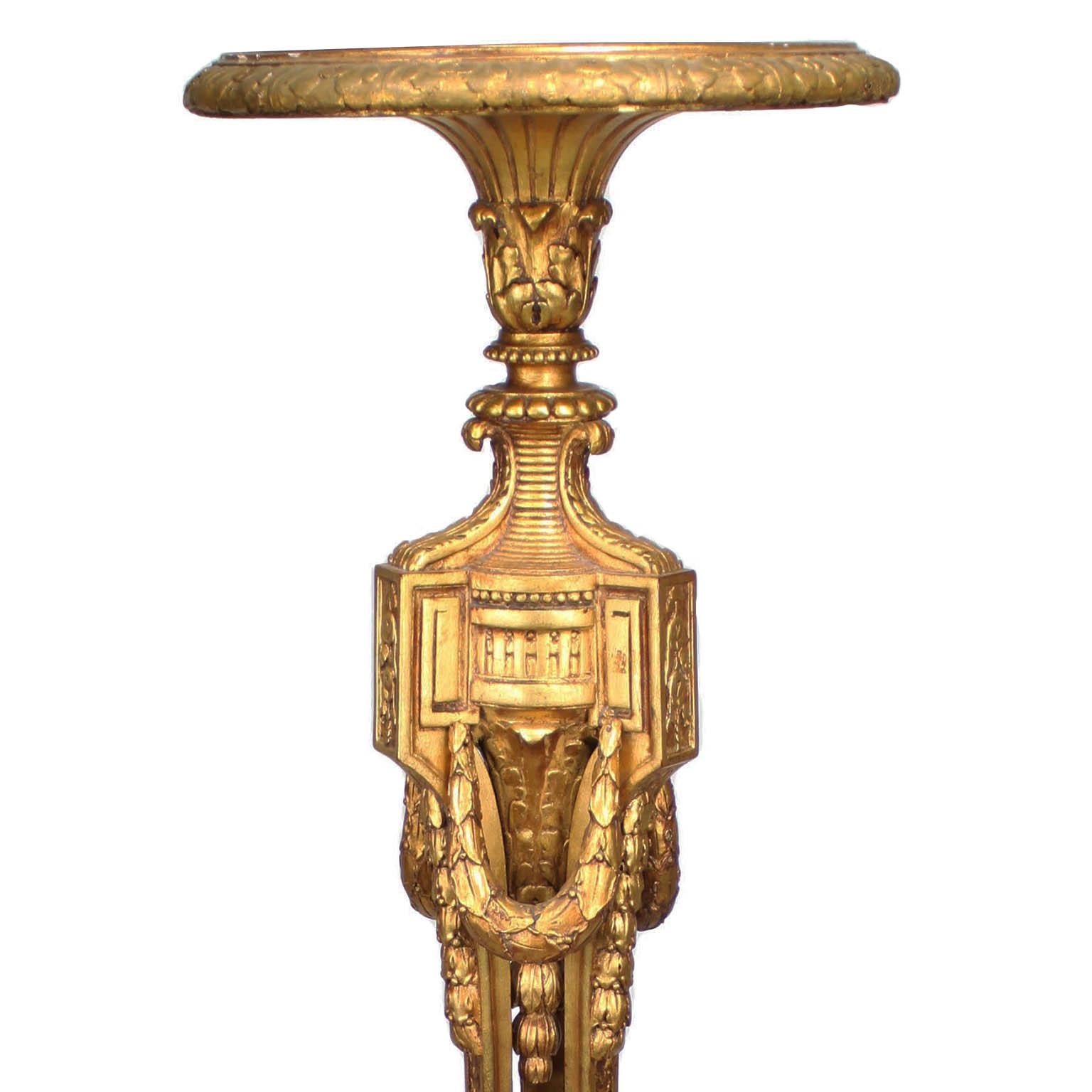 A French Belle Époque Louis XVI Style Giltwood Carved Torchere (Torchière) Pedestal Stand, attributed to François Linke (1855-1946), Index number 1546 
Paris, 1907. The slender tripod body, surmounted with laurel wreaths, rosettes and scrolls and a