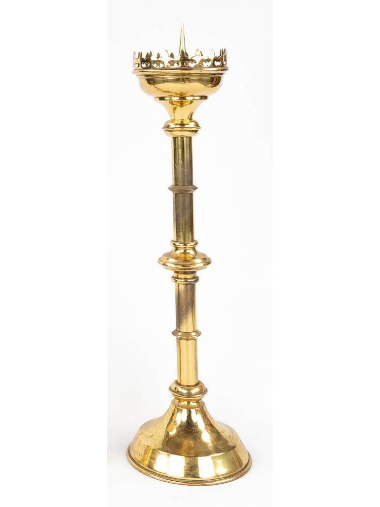A tall gilt brass European Gothic Revival pricket candlestick

Anonymous
Europe; first-half 20th century
Gilt Brass

Approximate size: 29 (h) x 6 (w) x 6 (d) in.

A tall gilt brass European Gothic Revival pricket candlestick with circular tapered