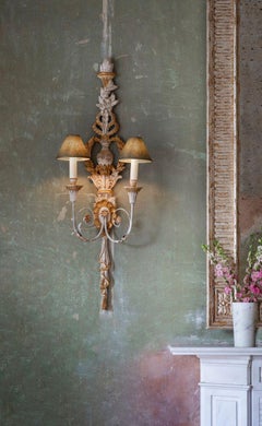 A tall giltwood wall light