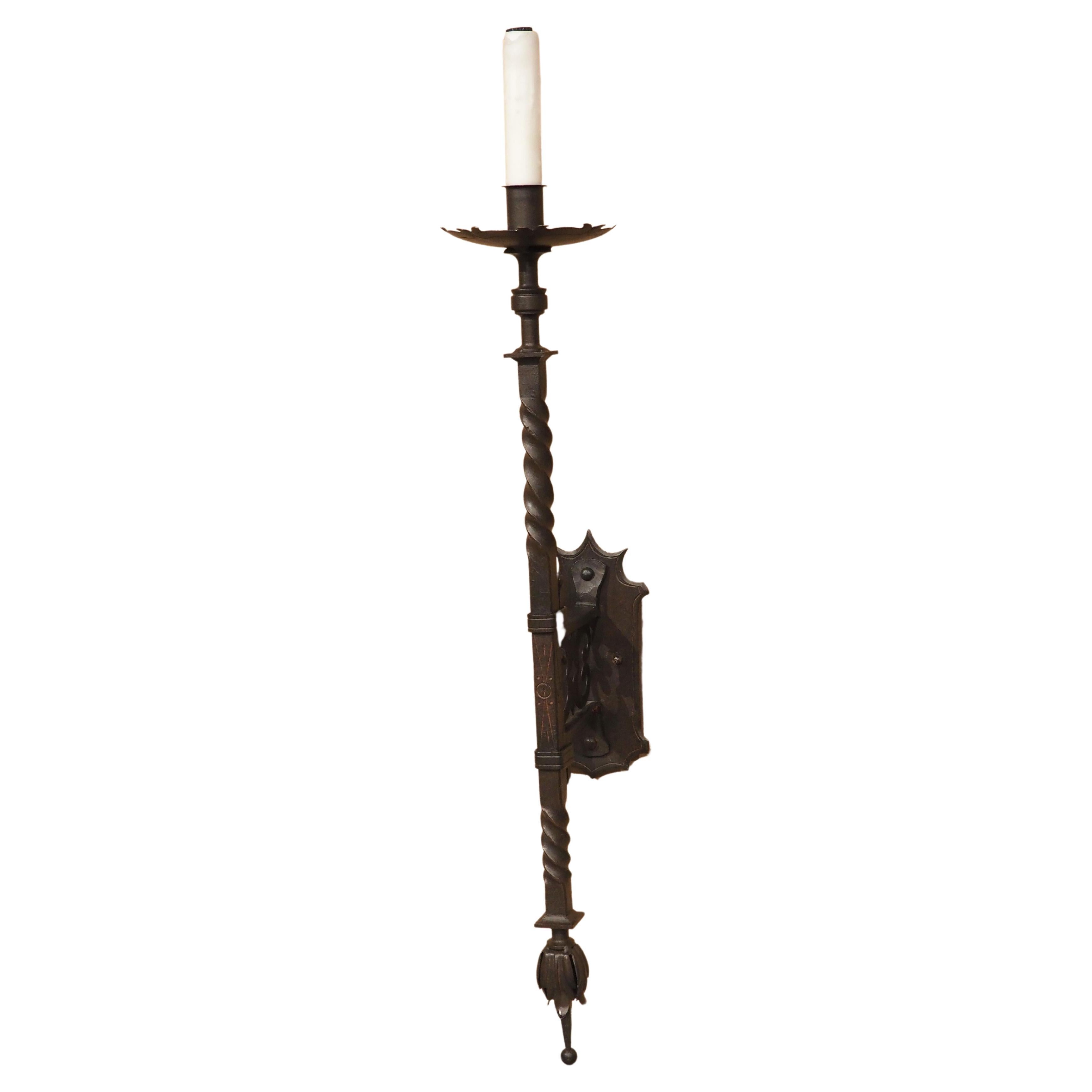 A Tall Hand Wrought Iron Torch Style Wall Sconce