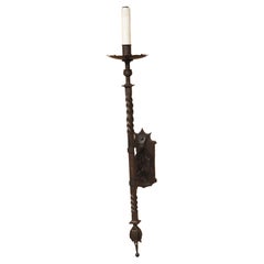 A Tall Hand Wrought Iron Torch Style Wall Sconce