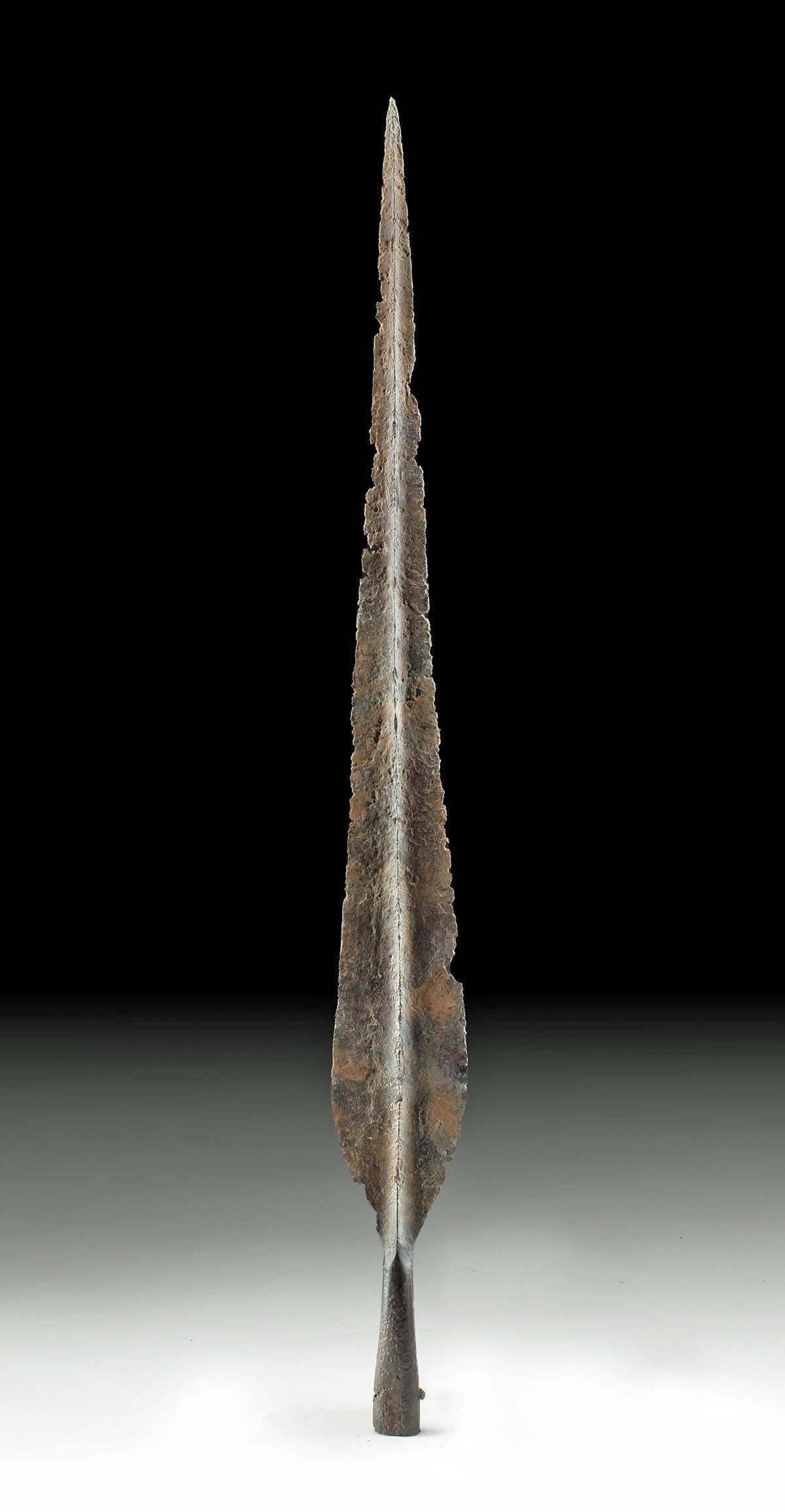 An impressively tall iron age spear tip from Northern Europe. Possibly of Celtic origin and from the 1st-5th century BC.

Measures: 77.8 cm x 7.9 cm.

While imposing in its practical form, the slender form of this iron blade terminates toward