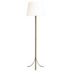 A Tall Neoclassical Metal Floor Lamp