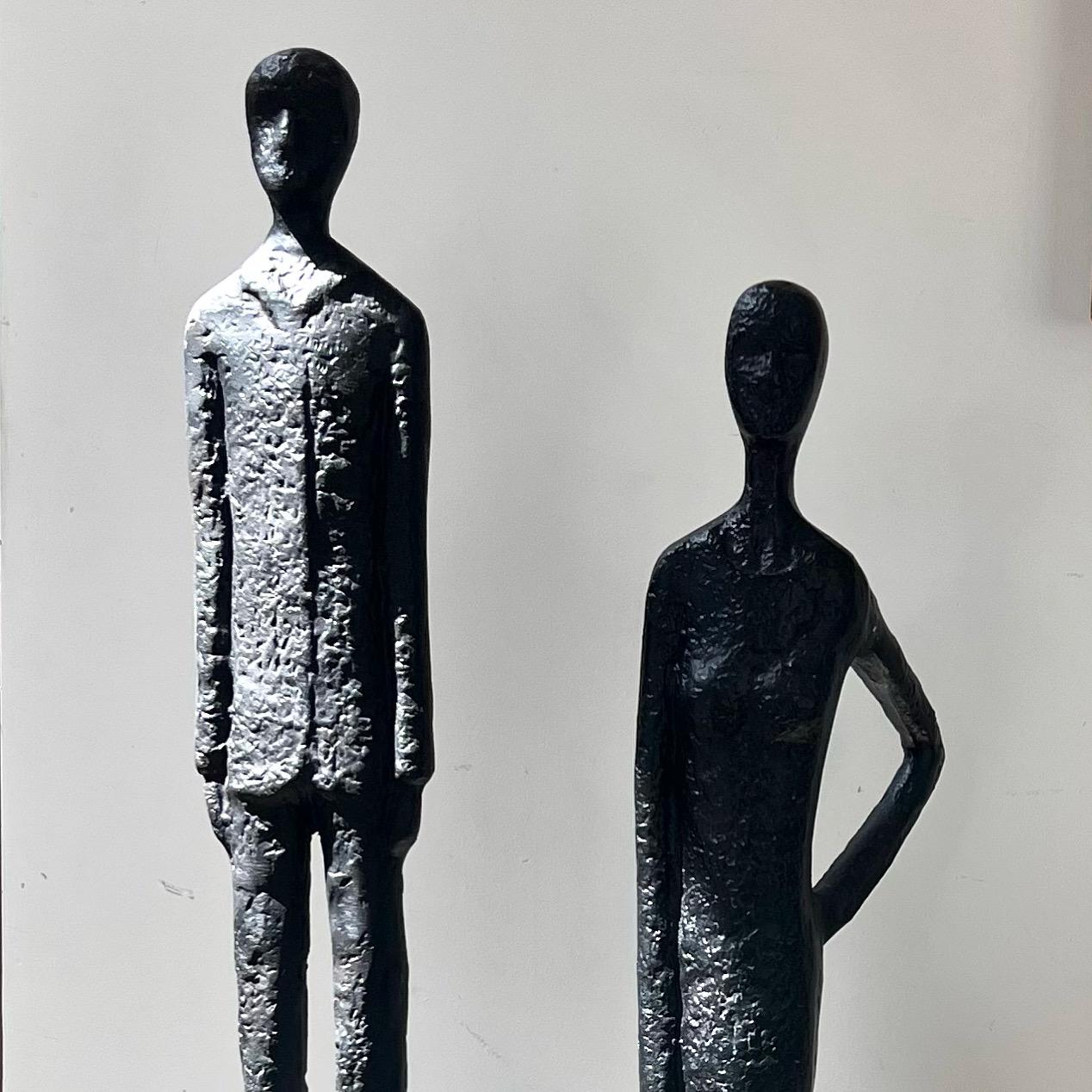 A tall pair of Giacometti style figurative floor sculptures, 20th century  1
