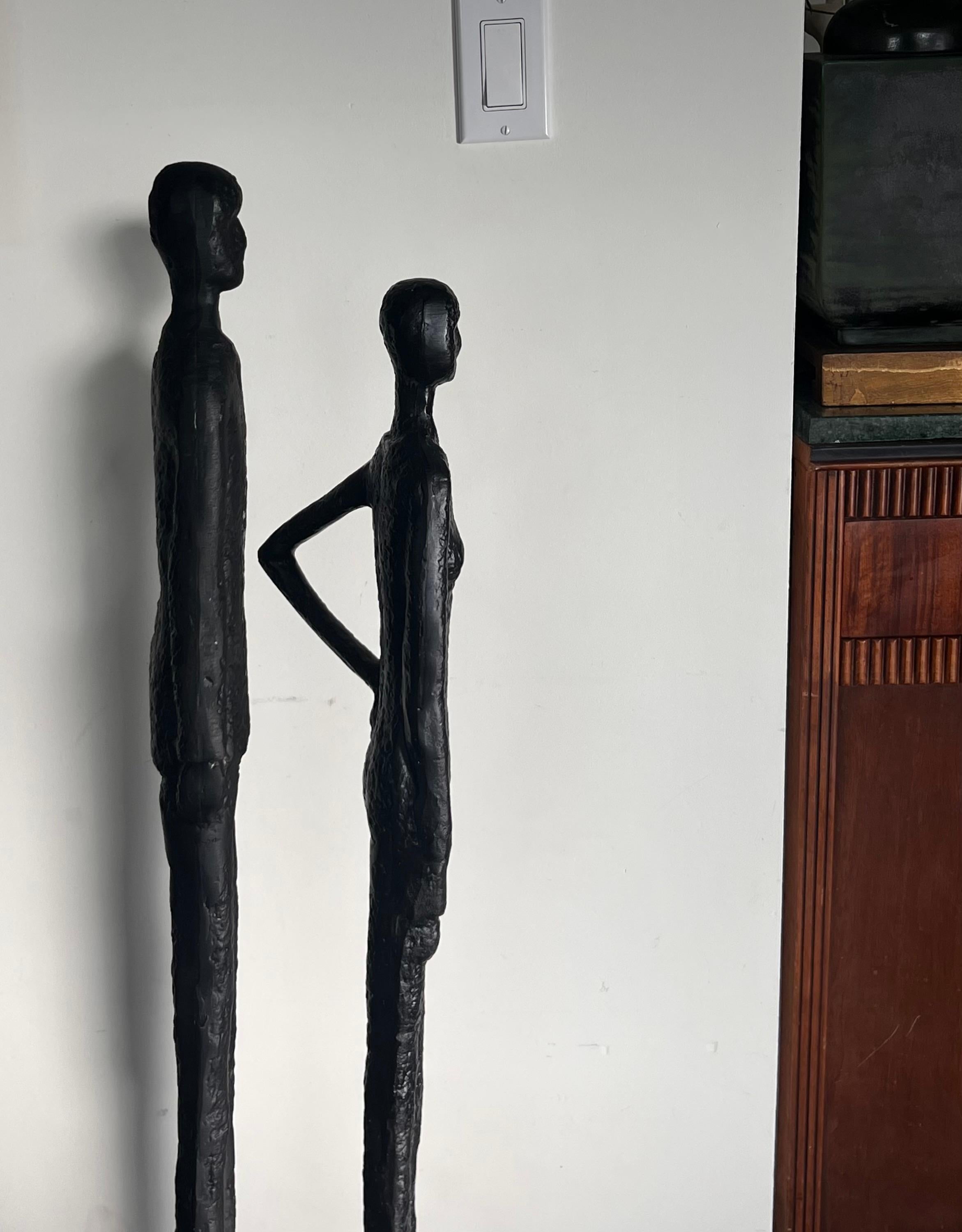 A tall pair of Giacometti style figurative floor sculptures, 20th century  10