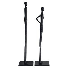 A tall pair of Giacometti style figurative floor sculptures, 20th century 