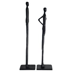 A tall pair of Giacometti style figurative floor sculptures, 20th century