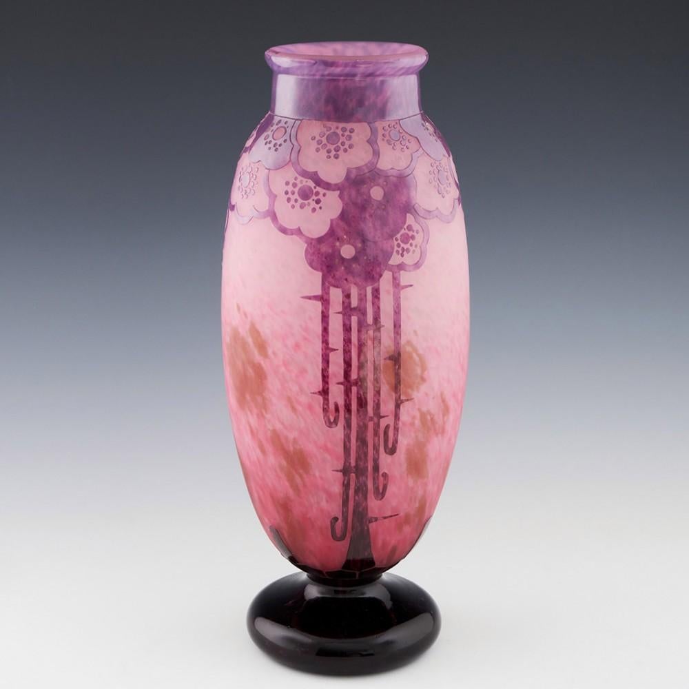 A Tall Schneider Eglantines vase made 1927-28 in Epinay-sur-Seine, Paris, France
The bowl features acid cut plum coloured decoration over a white, rose with russet mottled satin finish ground. Incised signature on the foot Le Verre Francais. The