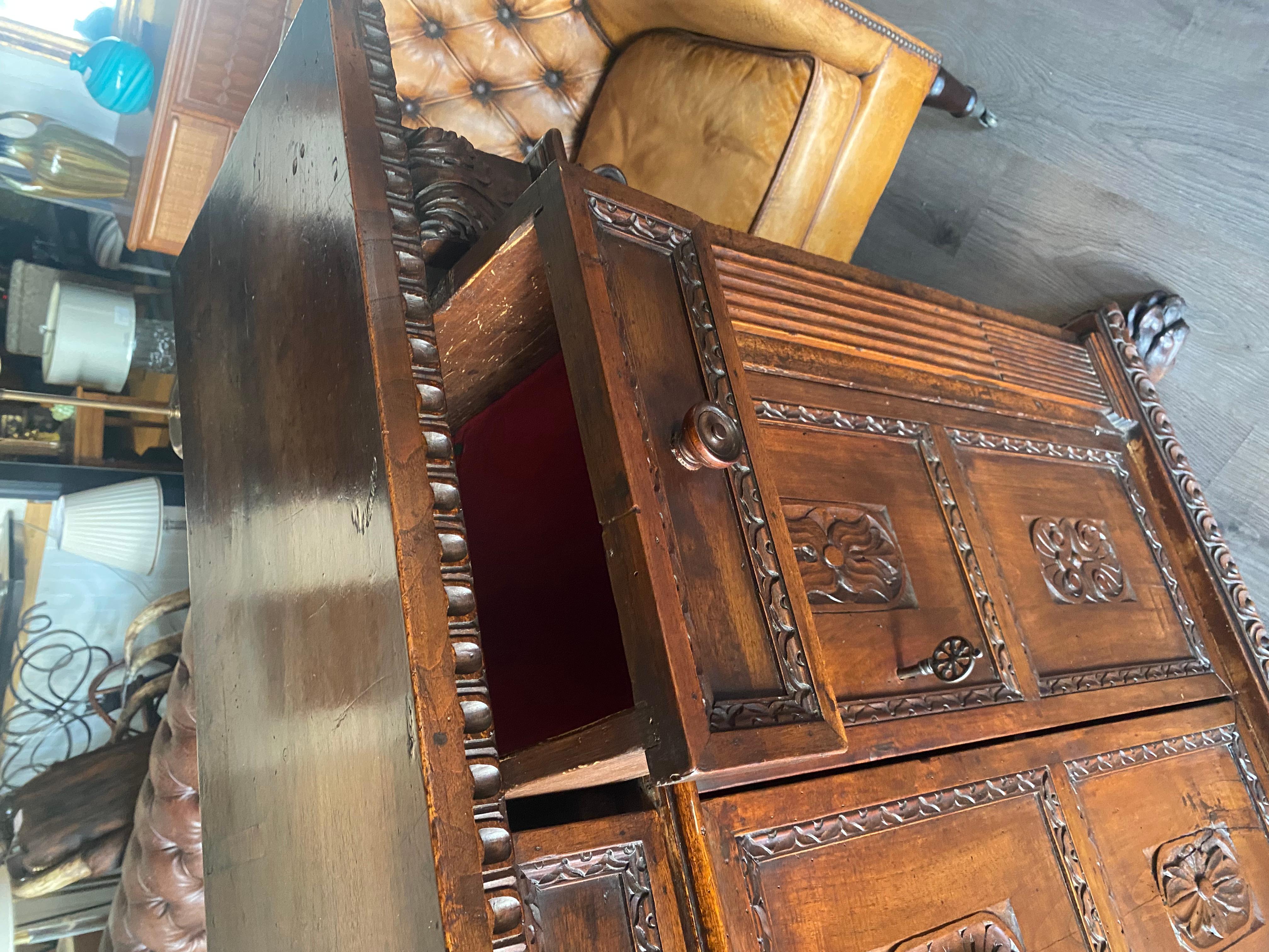 A tall 17th C. walnut cabinet buffet, having a plank top with dentil moulding. For Sale 3
