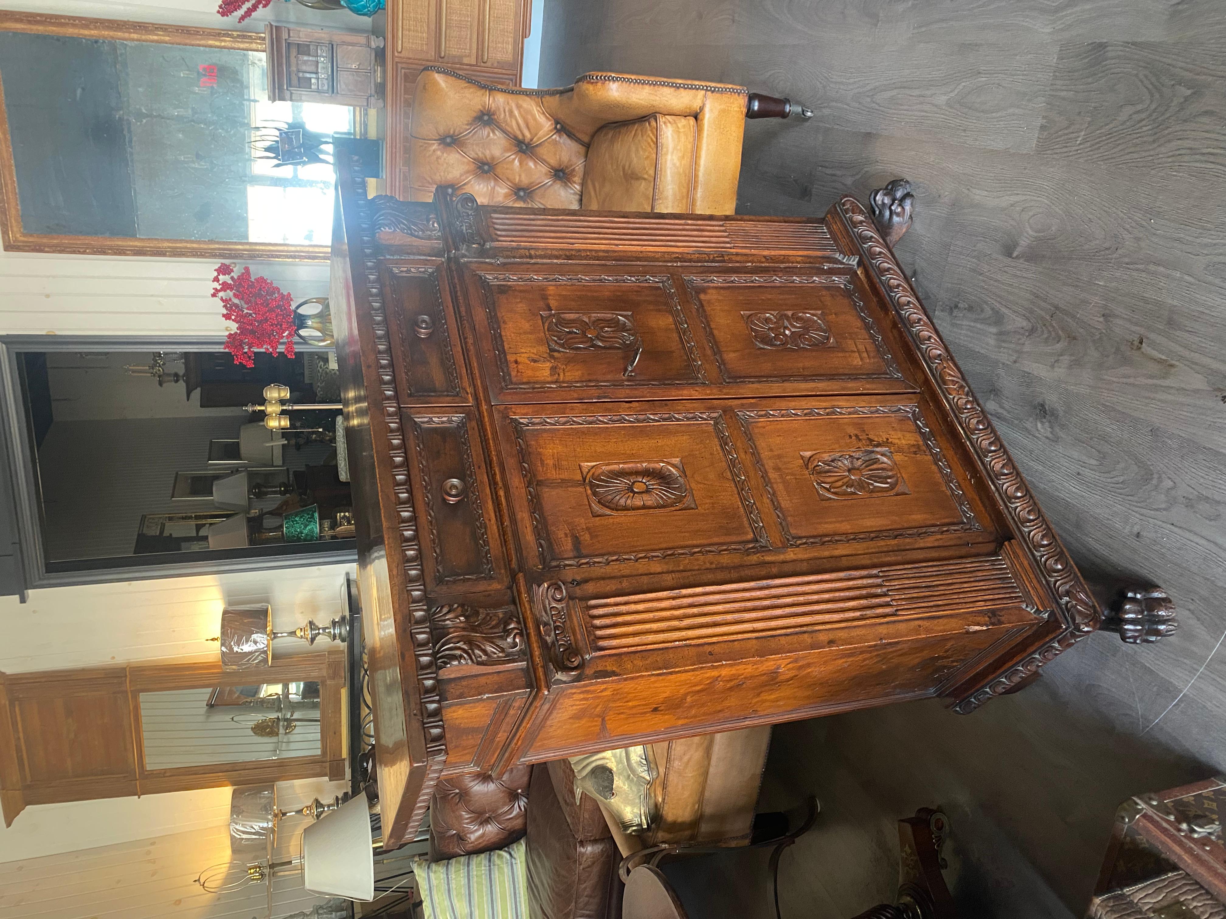 Renaissance A tall 17th C. walnut cabinet buffet, having a plank top with dentil moulding. For Sale