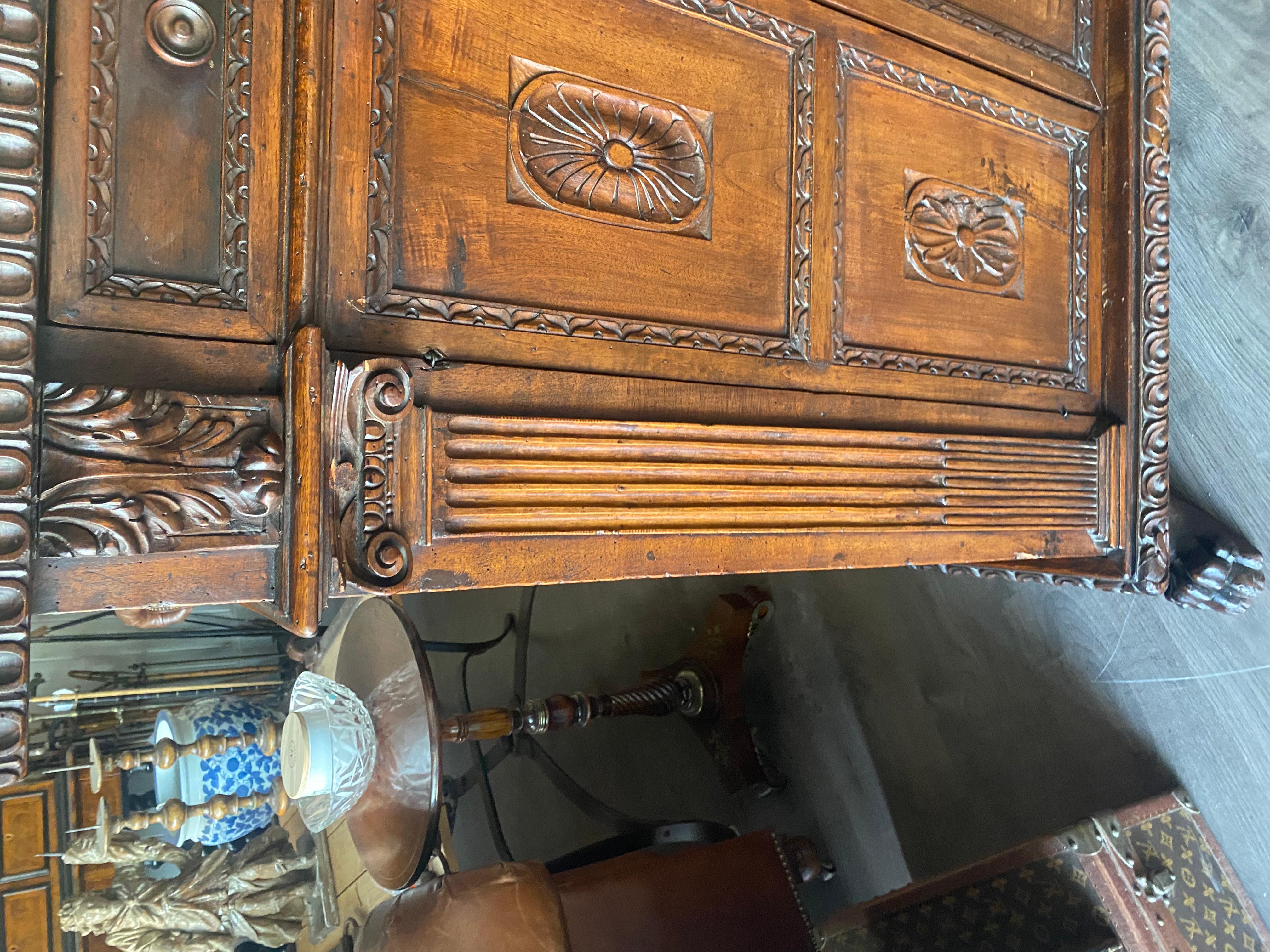 A tall 17th C. walnut cabinet buffet, having a plank top with dentil moulding. In Good Condition For Sale In Buchanan, MI