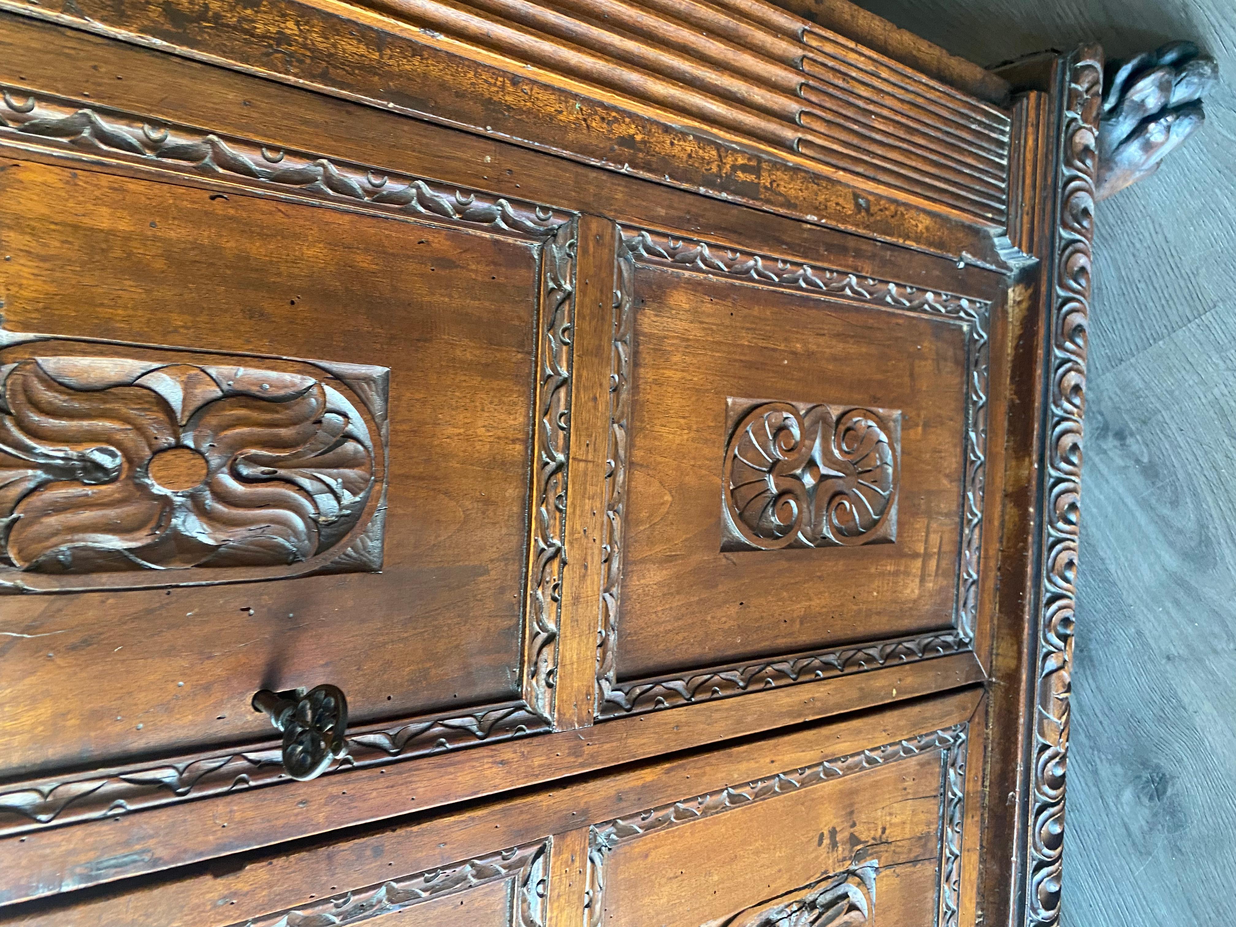 Walnut A tall 17th C. walnut cabinet buffet, having a plank top with dentil moulding. For Sale