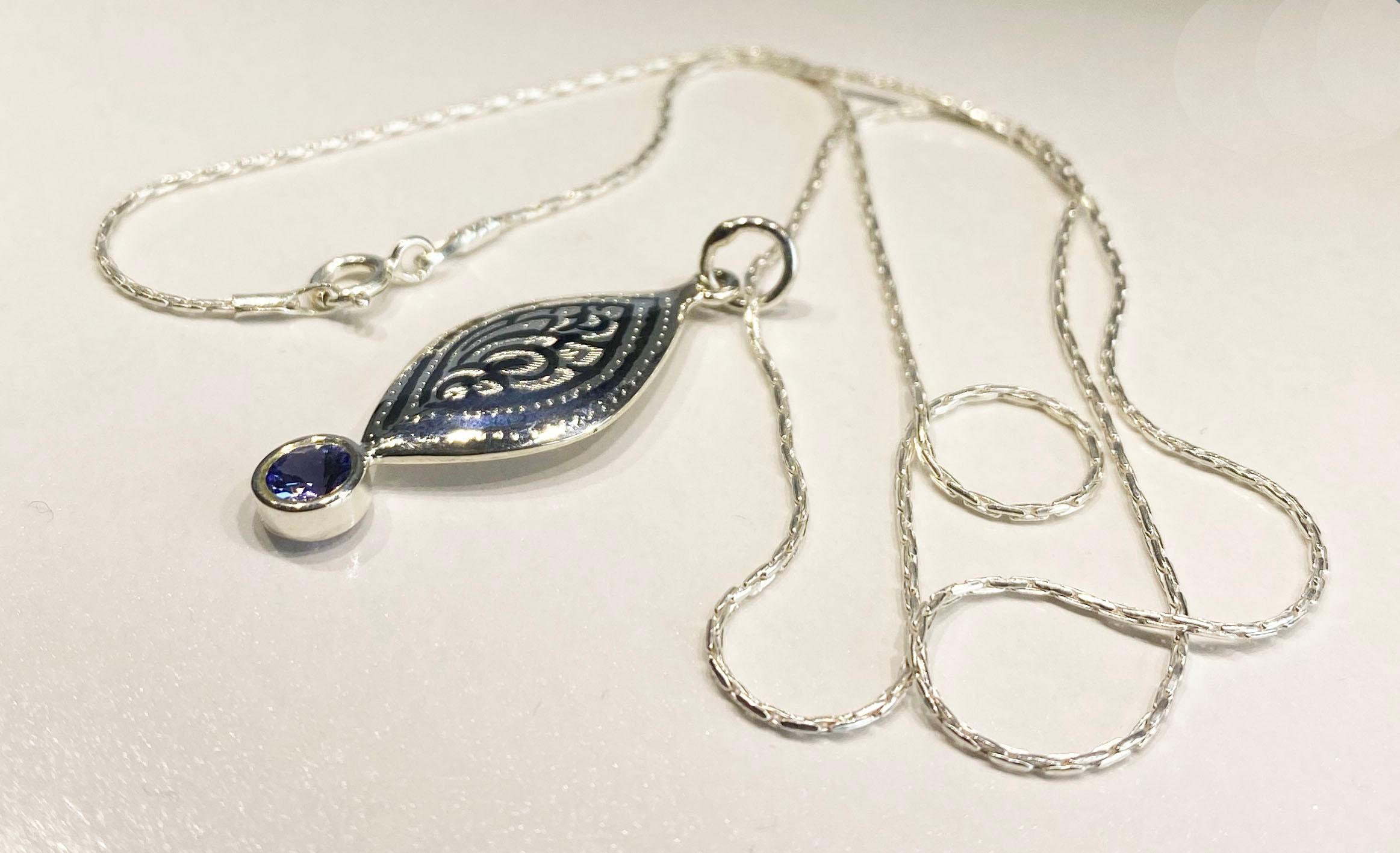 A Silver Filagree Pendant set with a 5MM Round Tanzanite  For Sale 4