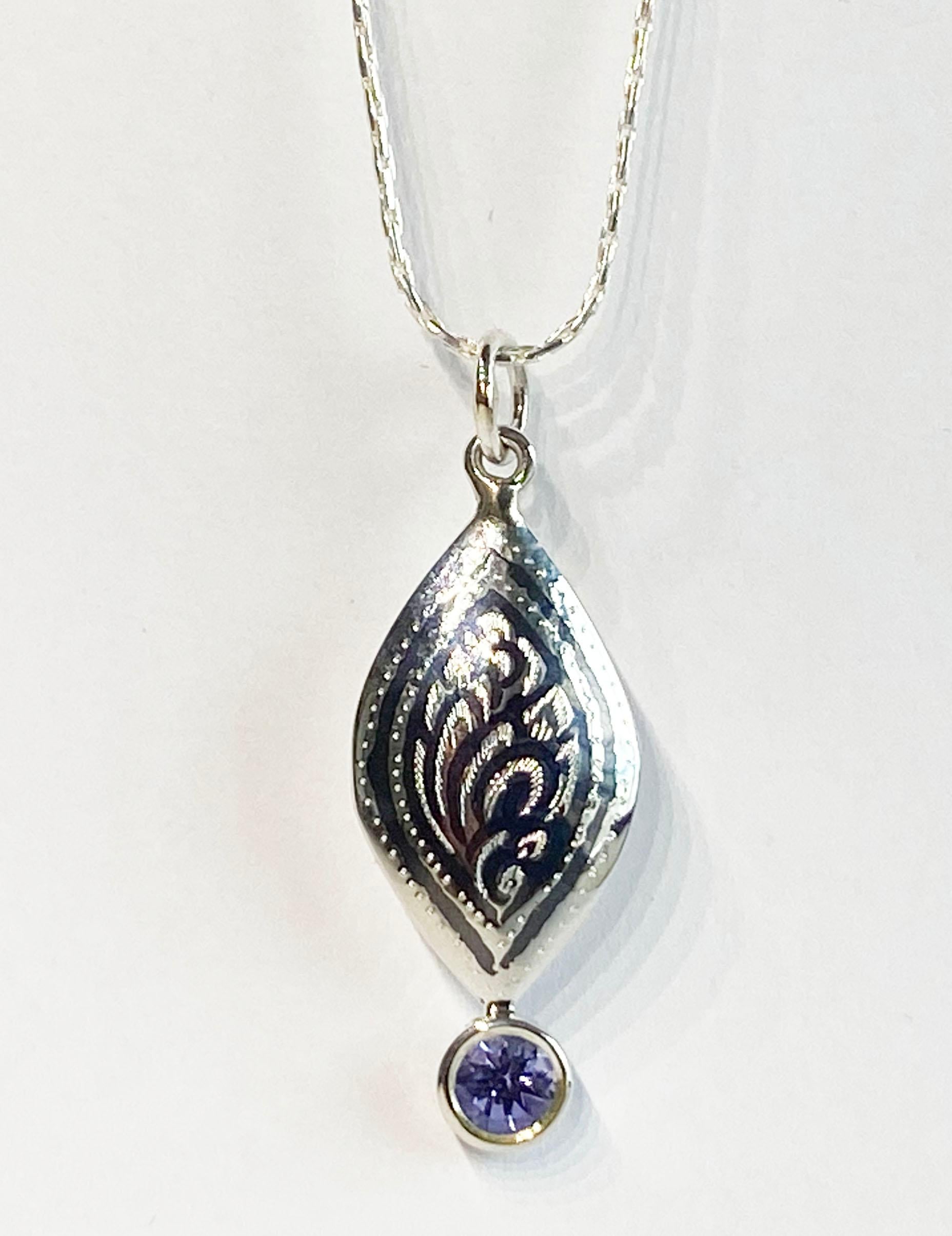 Artisan A Silver Filagree Pendant set with a 5MM Round Tanzanite  For Sale