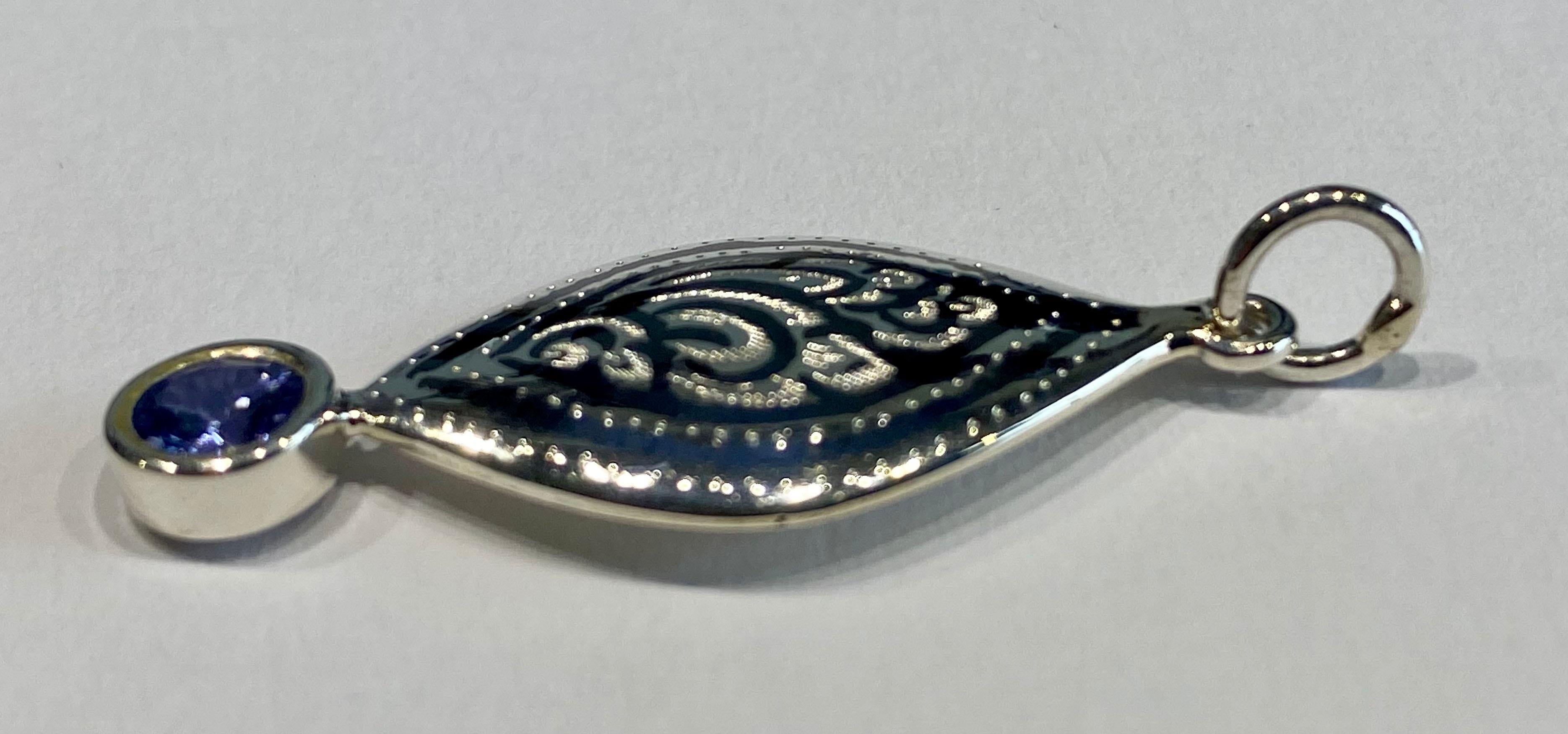 Brilliant Cut A Silver Filagree Pendant set with a 5MM Round Tanzanite  For Sale