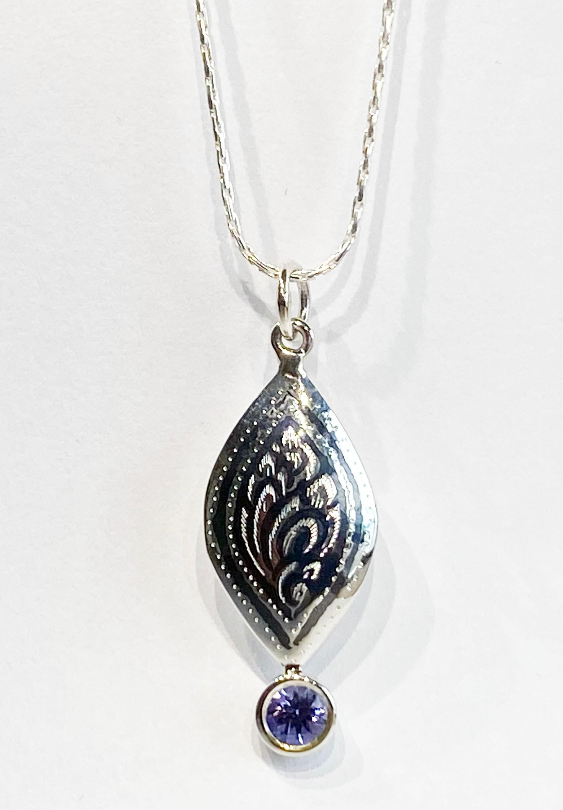 A Silver Filagree Pendant set with a 5MM Round Tanzanite  For Sale 3