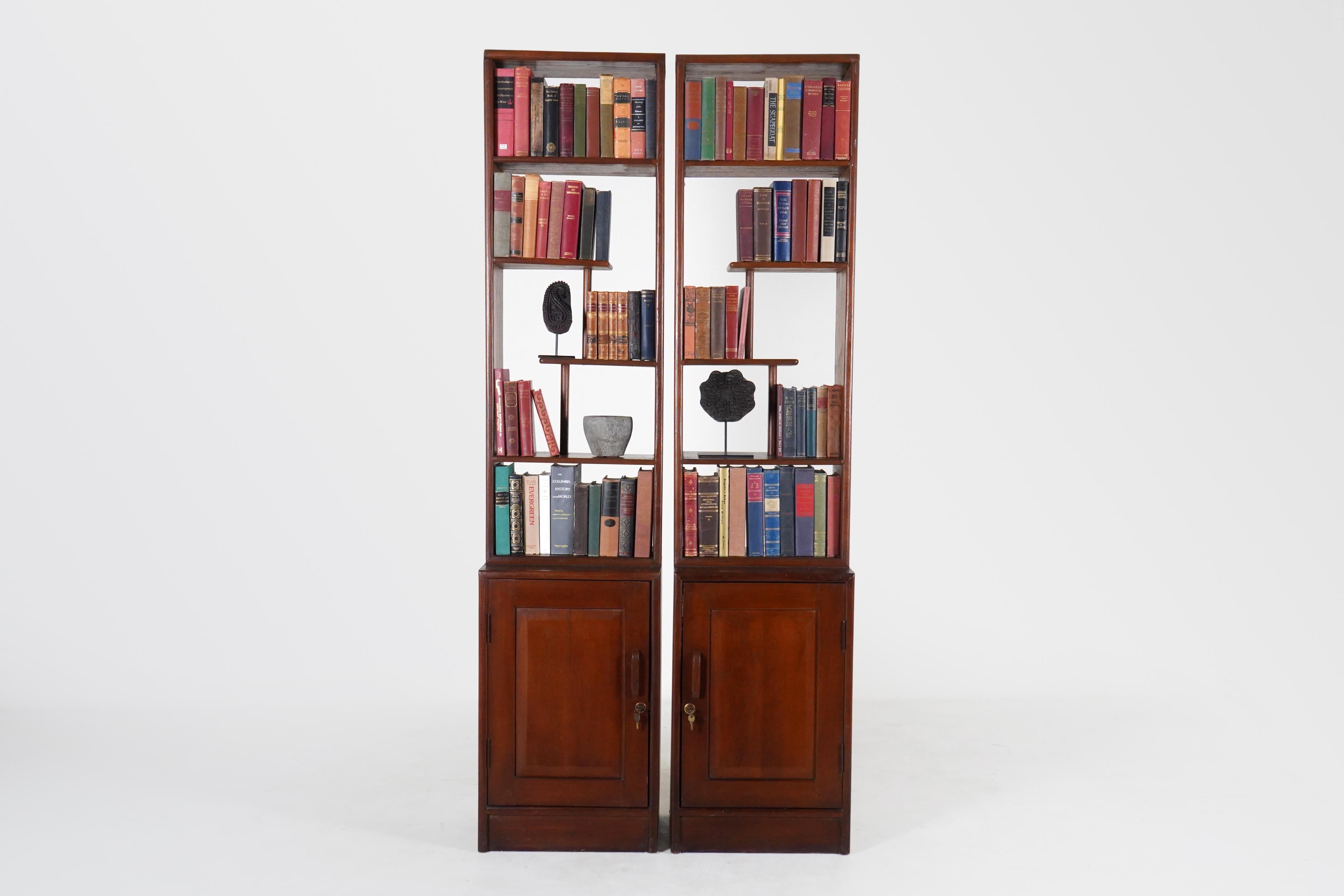 This open antique bookshelf was made from solid teak wood and dates to the 19th Century. During the British Empire in India and Burma much furniture was made in the Anglo-Indian style using native hardwoods and native craftsmen. Styles closely