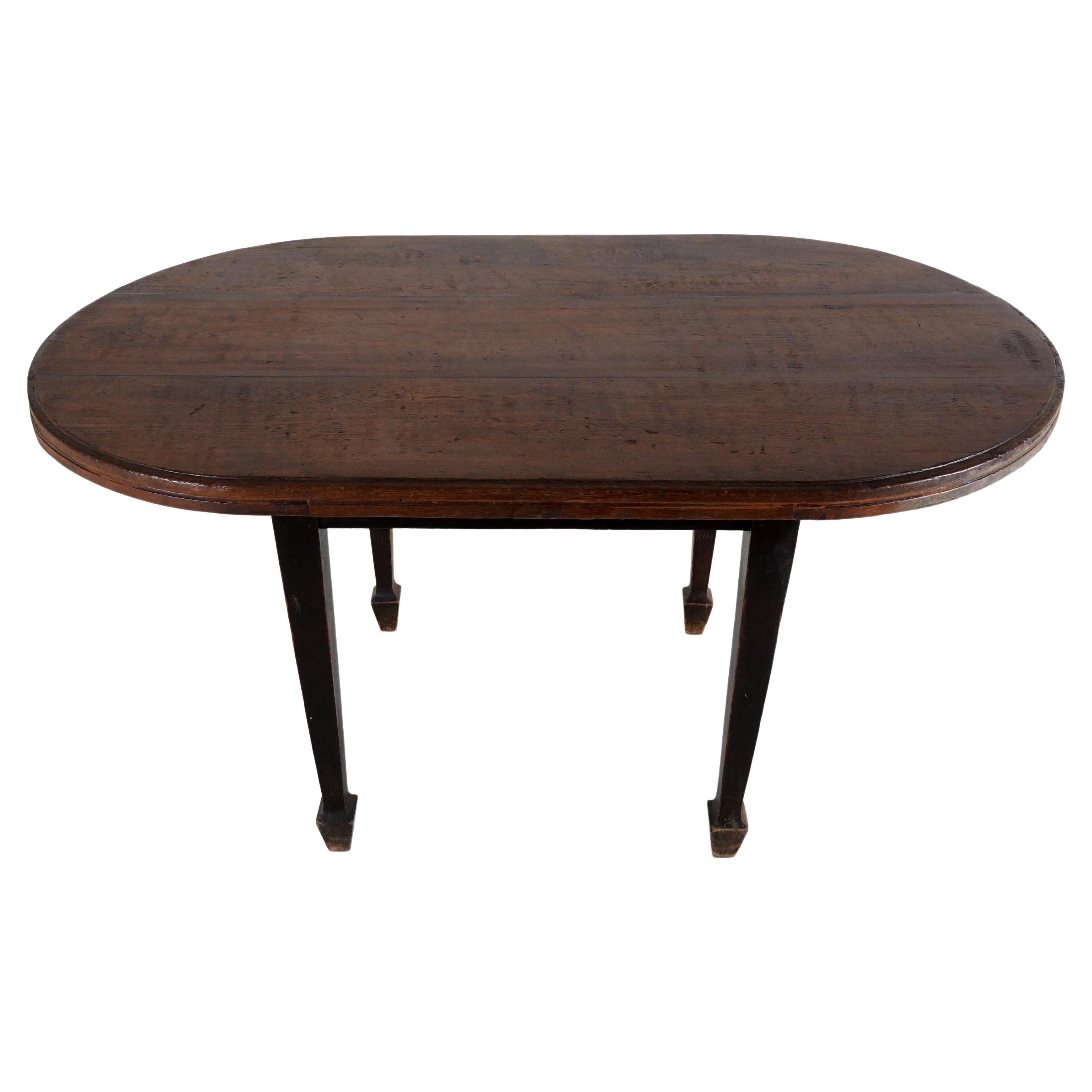 A Teak Wood Oval Dining Table For Sale