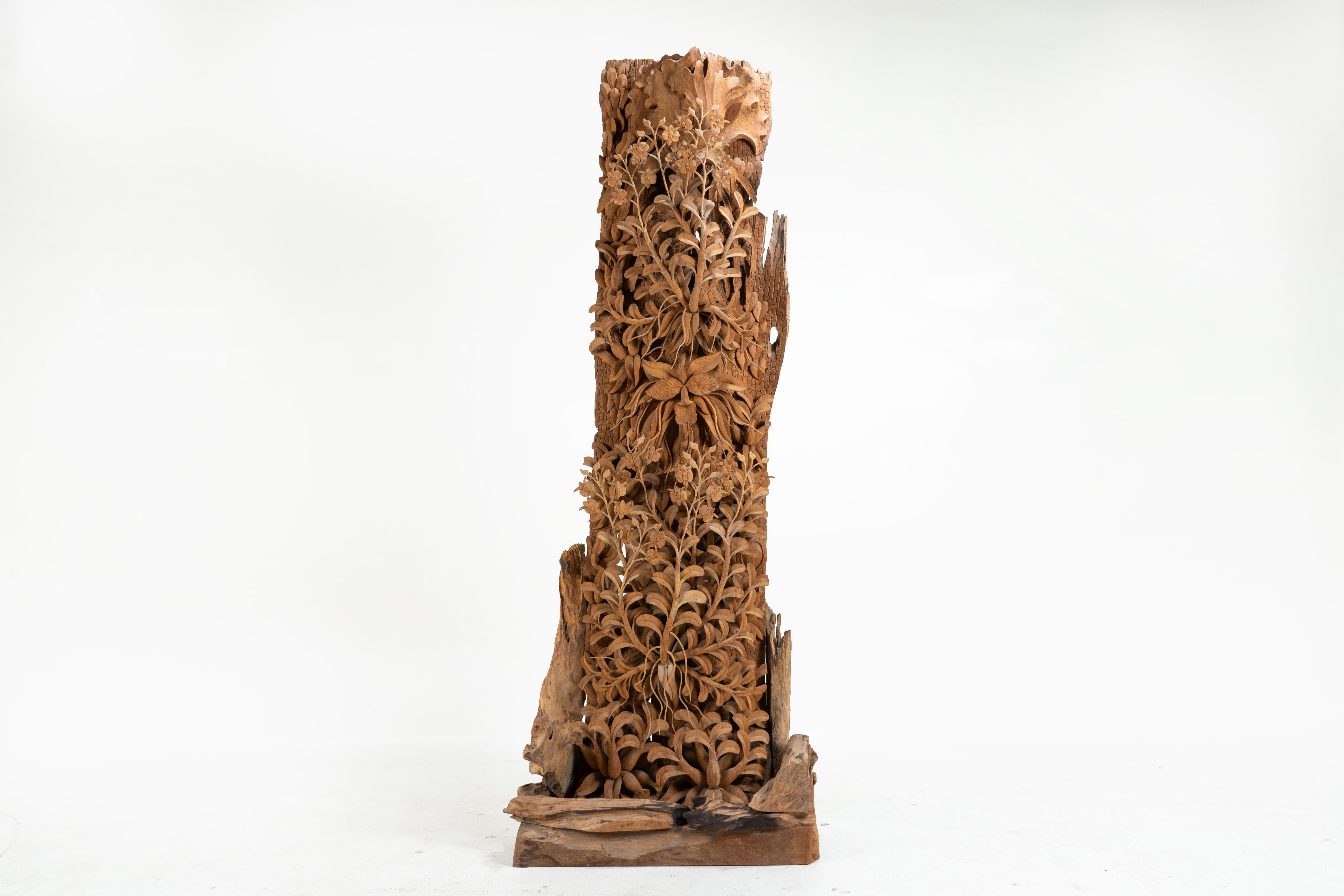 This extraordinarily life-like sculpture depicts orchids growing in the Asian forest. Thai wood carvers are very adept at carving teakwood into countless forms, including religious sculptures, elephants, fretwork panels, furniture and more. Teak is