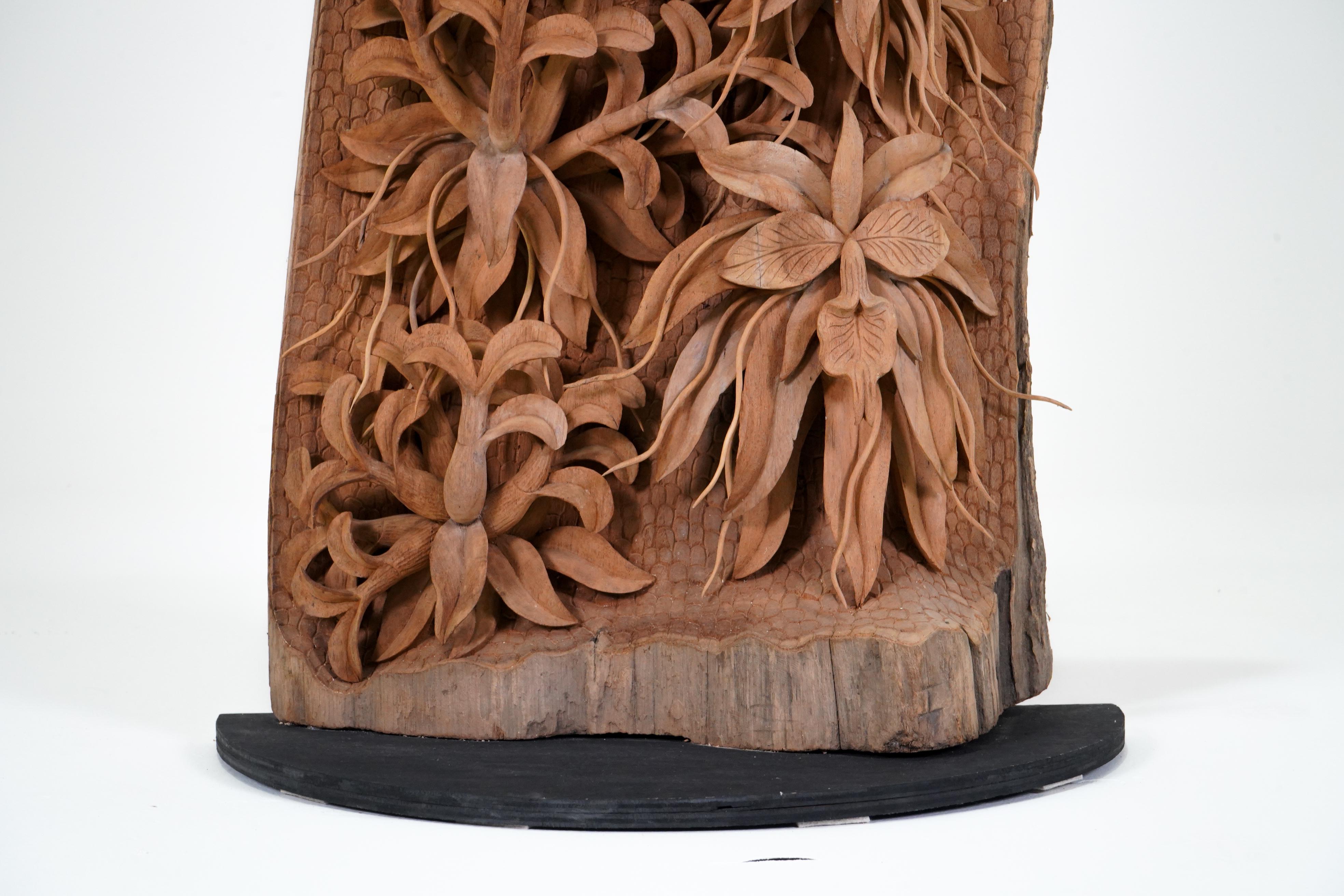 A Teakwood Carving of an Orchid 1