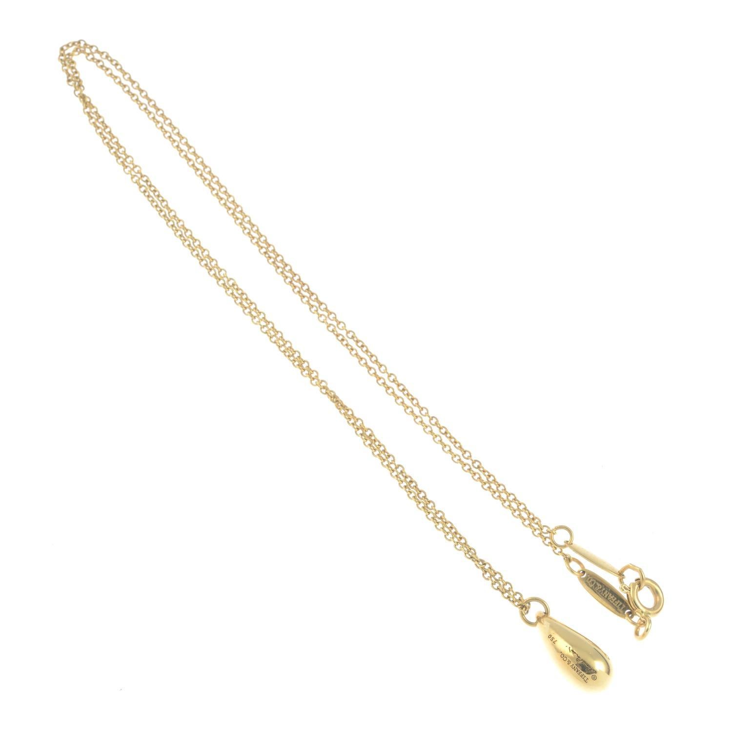Signed Elsa Peretti, Tiffany & Co. Stamped 750. Length of pendant 1.4cms. Length of chain 41cms. 4.9gms. 