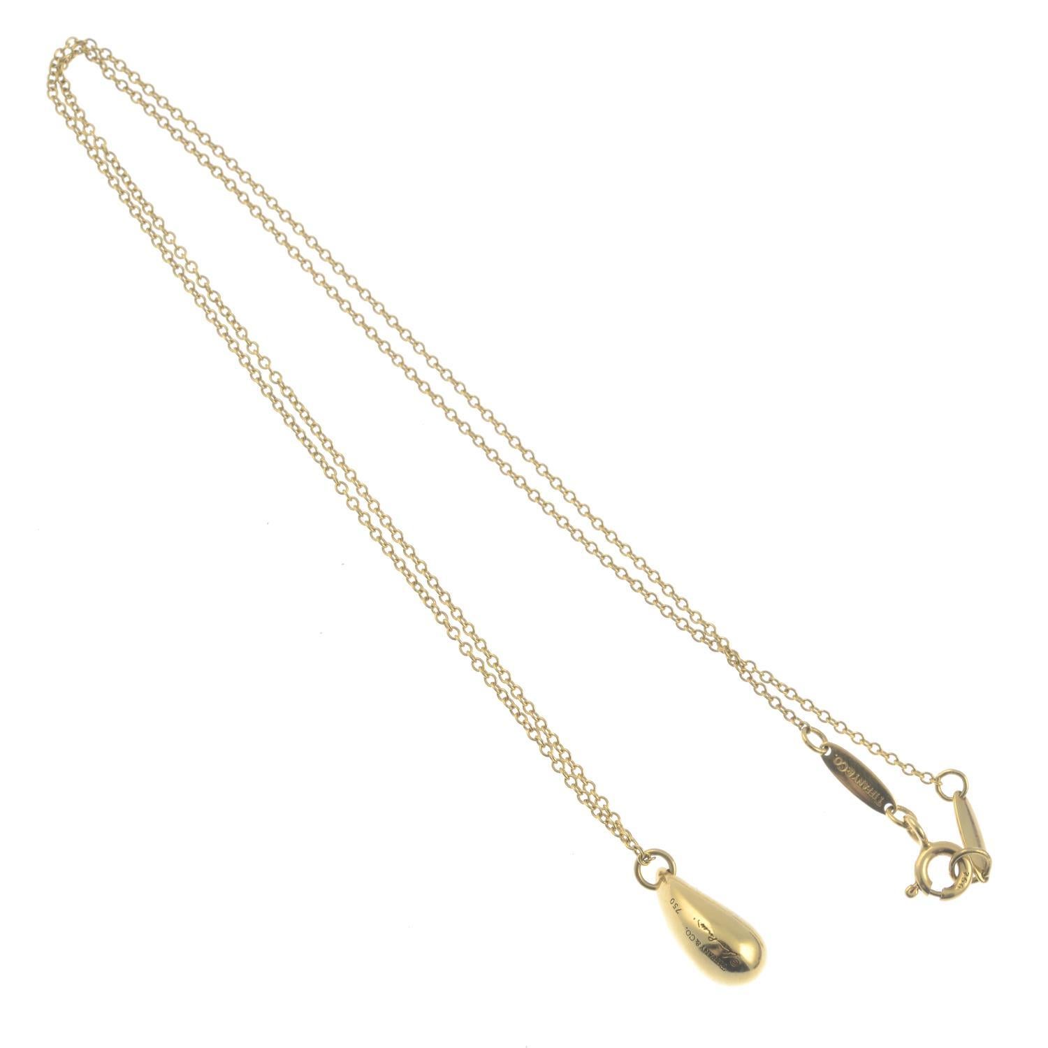 Signed Elsa Peretti, Tiffany & Co.Stamped 750. Length of pendant 1.4cms. Length of chain 40cms. 4.7gms. 