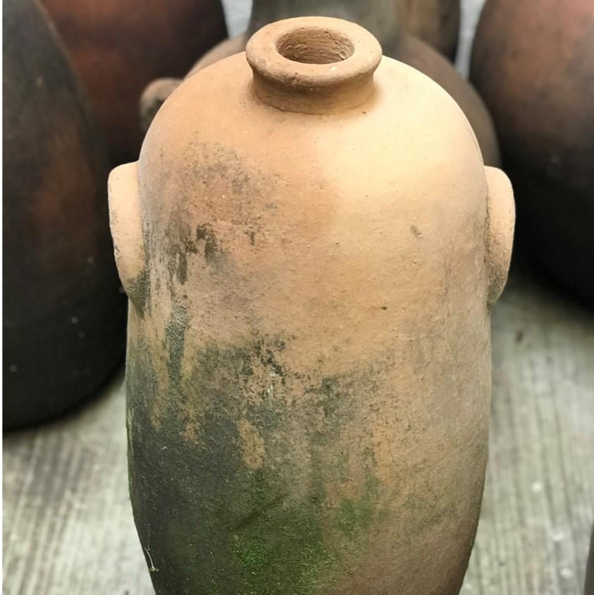 Ramon is a sensuous, slightly irregular shape terra-cotta vessel with mossy patina. Vessels like this were traditionally used to store mezcal, and were often seen in the homes designed by architect Luis Barragán.

Discovered at an abandoned potters