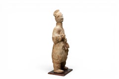 A Terracotta Figure of a Cook Holding Birds