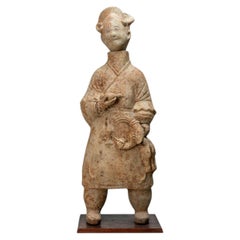A Terracotta Figure of a Cook Holding Birds