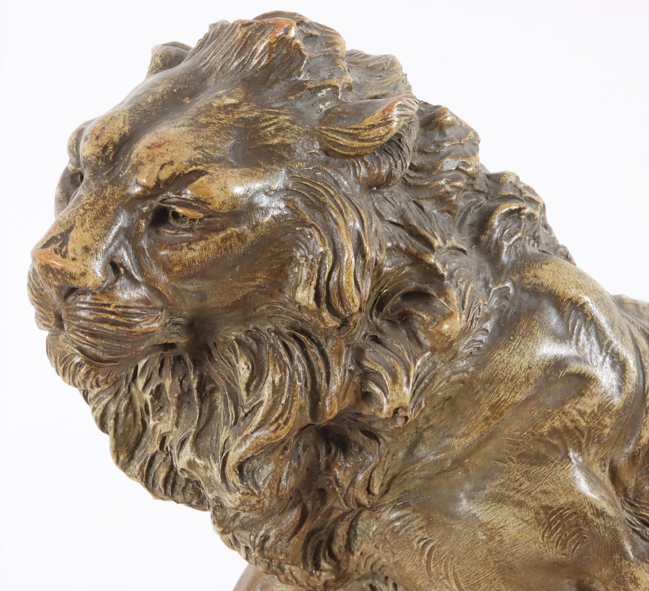A fine patinated terracotta sculpture from around ca.1900 of a lion signed A. Fagotto. Armand Fagotto was a Italian sculptor working during the end of the 19th century and early 20th century.