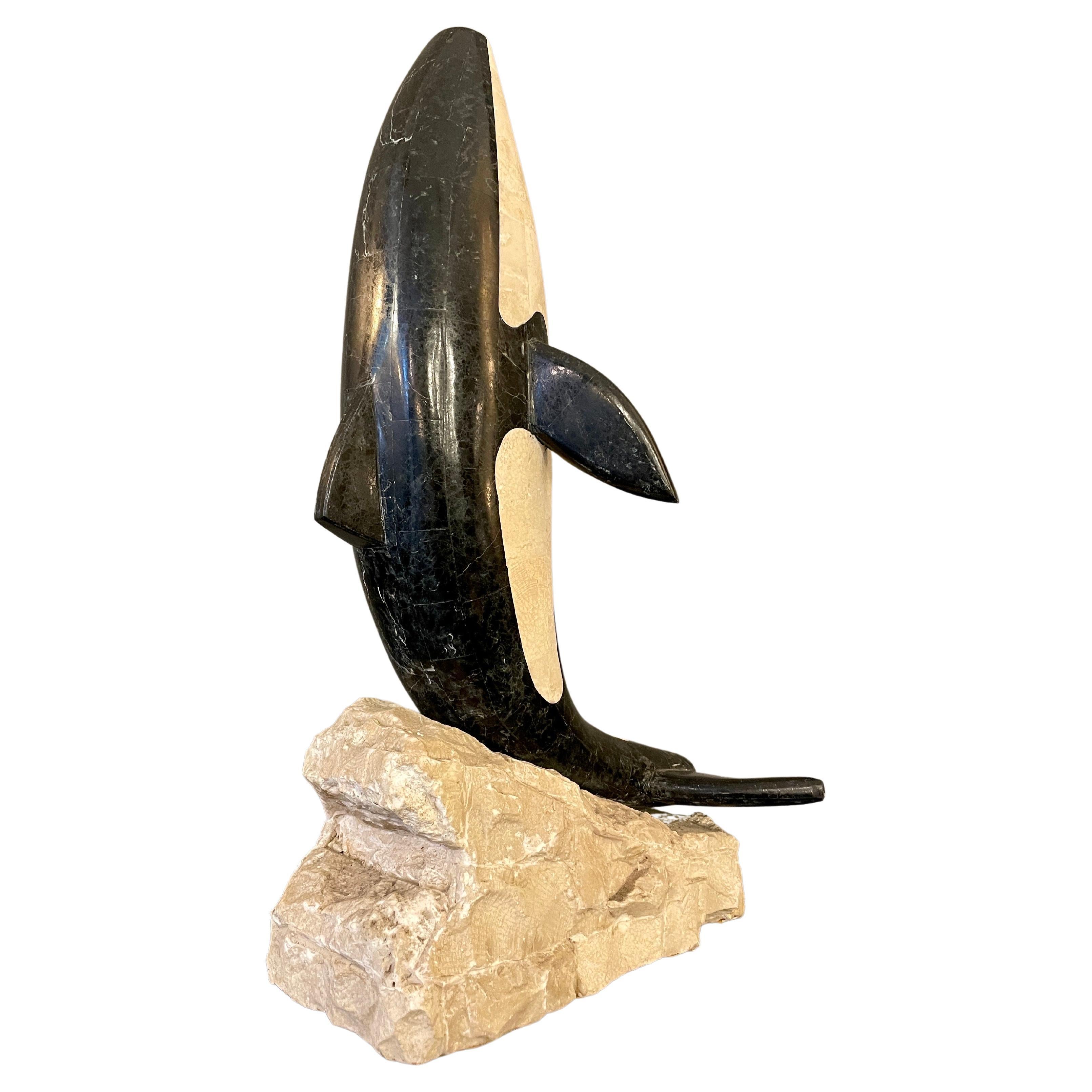 A large tessellated marble orca or killer whale animal sculpture by Maitland Smith. Mounted on a stone base. Images a true reflection of size and condition.
A tessellation (or tiling) is when we cover a surface with a pattern of flat shapes so that