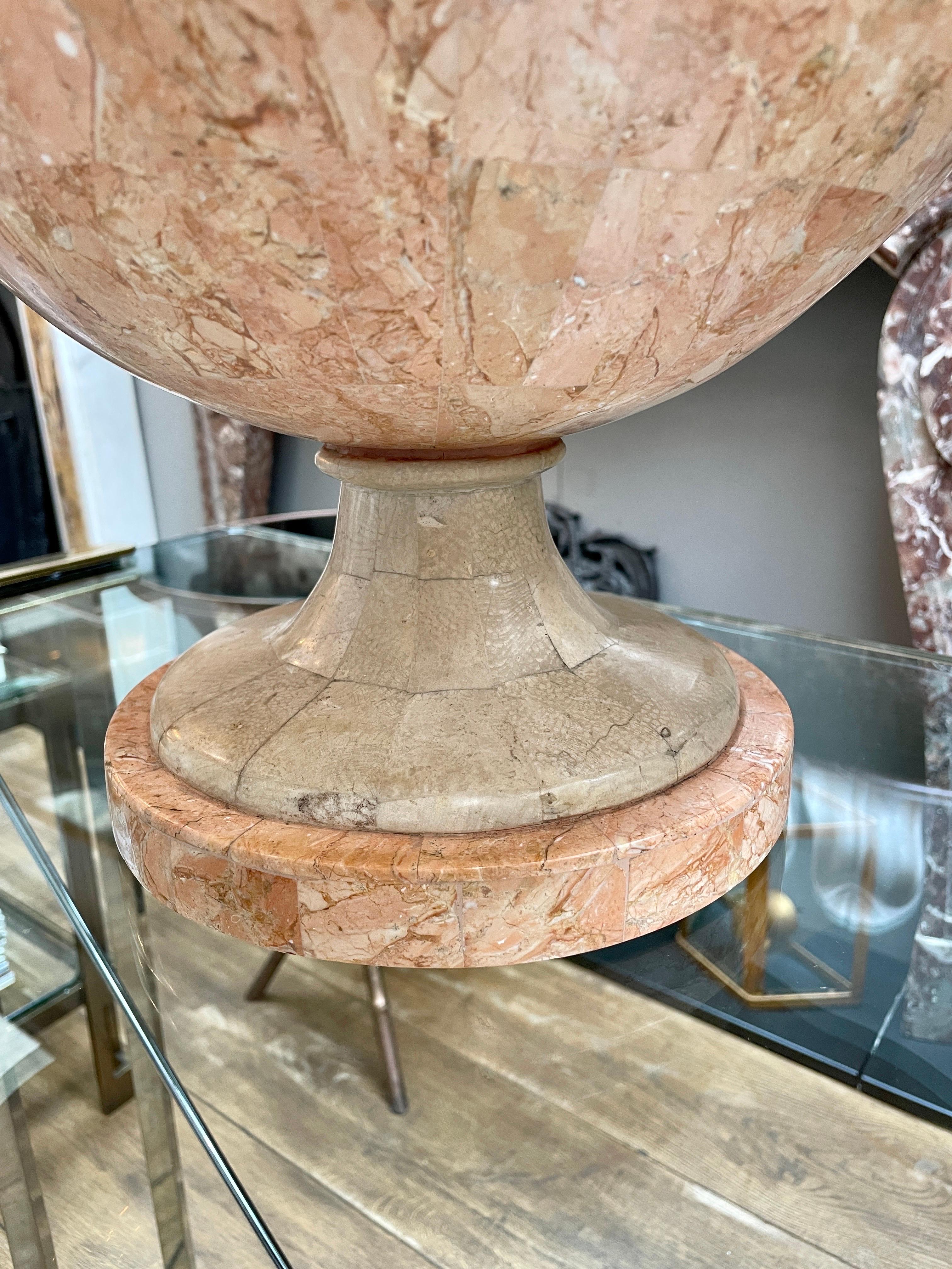 A large Tazza in pink and cream tessellated marble by Maitland Smith USA.
The circular socle plinth supporting the bowl with an undulating rim. A large Tazza in very good order.
