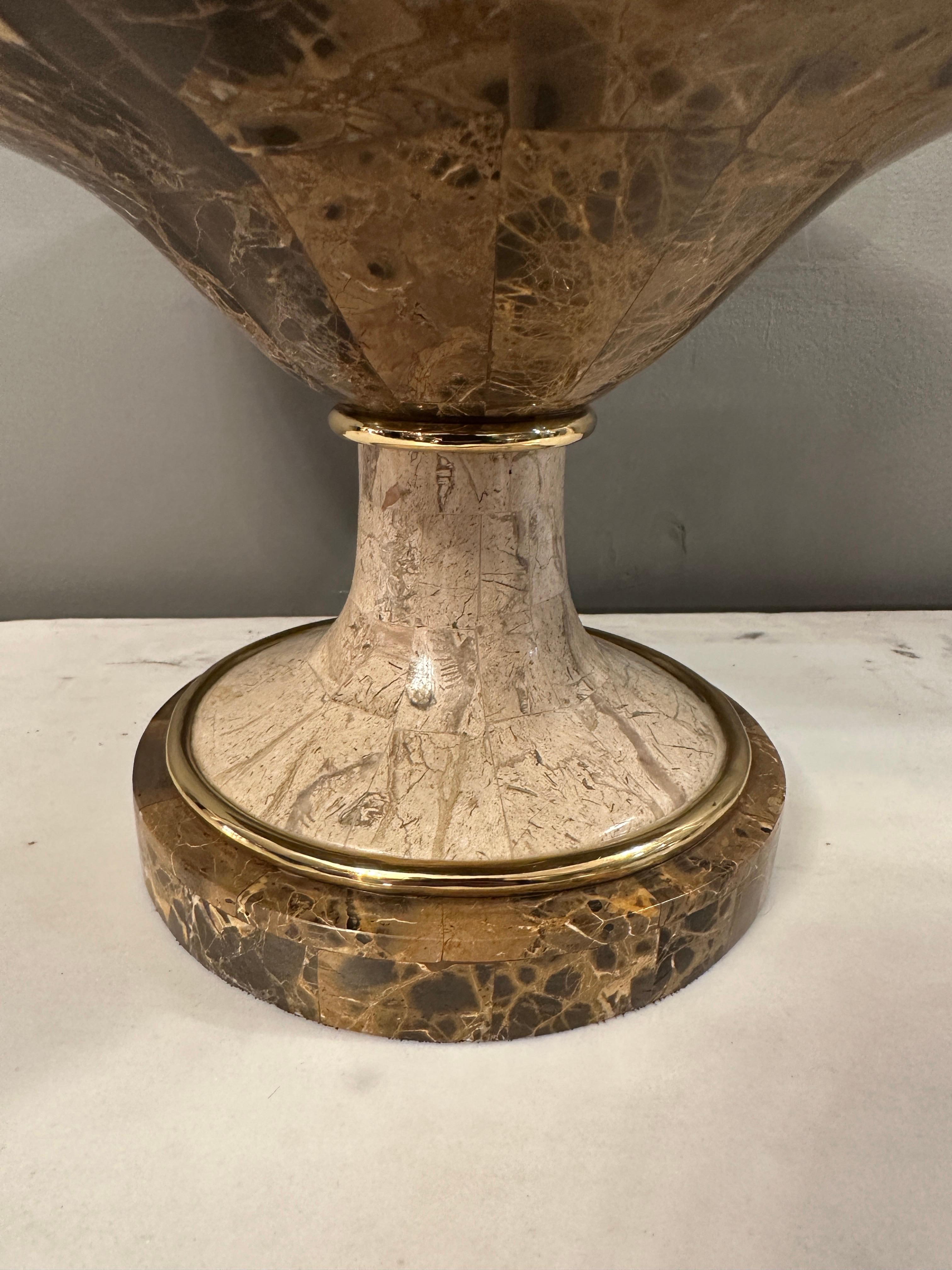 A Tessellated marble Tazza urn in Italian Emporador Marble. The undulating edge on the dish with brass banded soccle support.