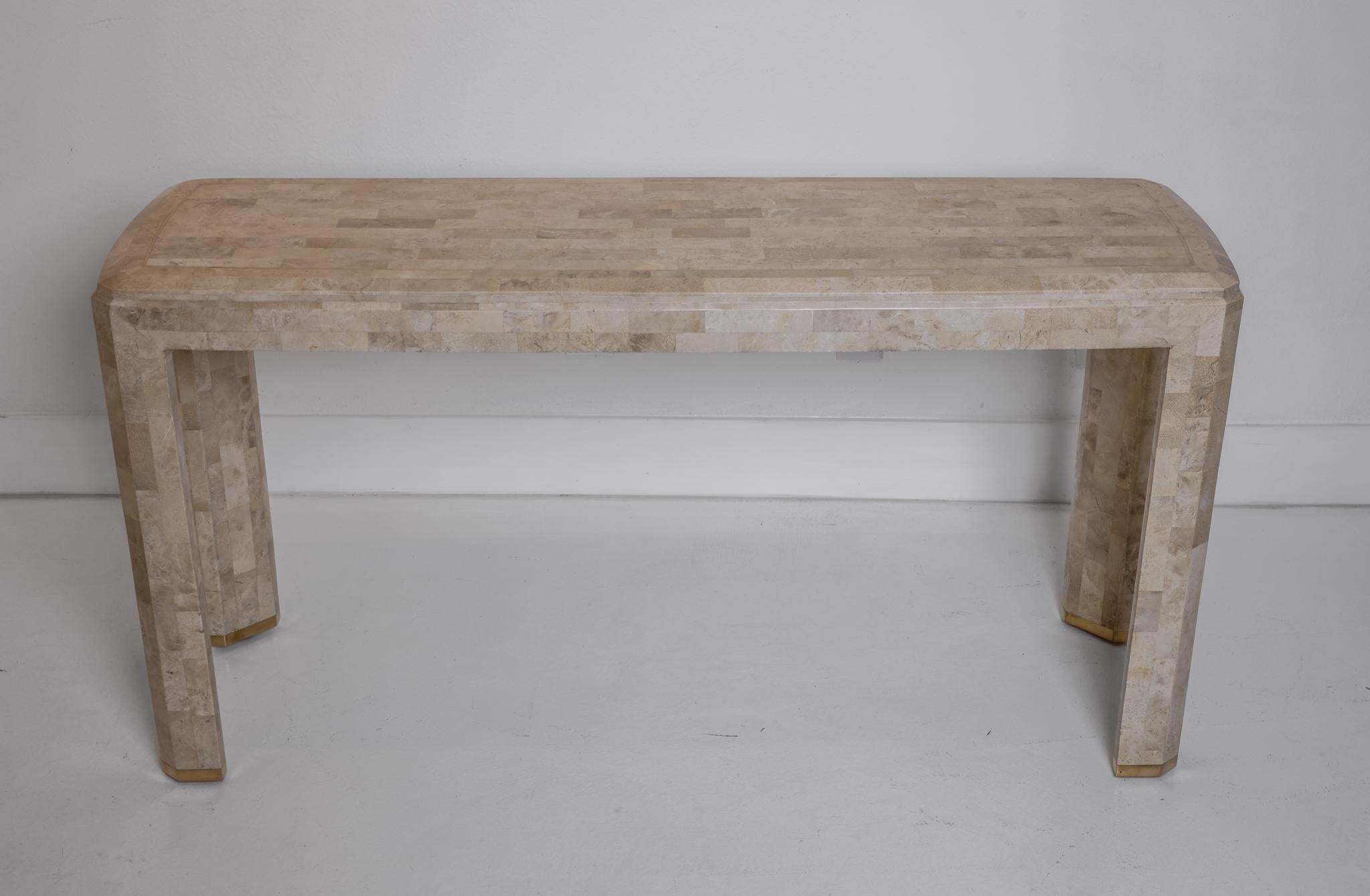This is a wonderfully simple yet beautiful tessellated stone veneered console. The featured stone specimens have been placed closely together and their sizes range from about 1