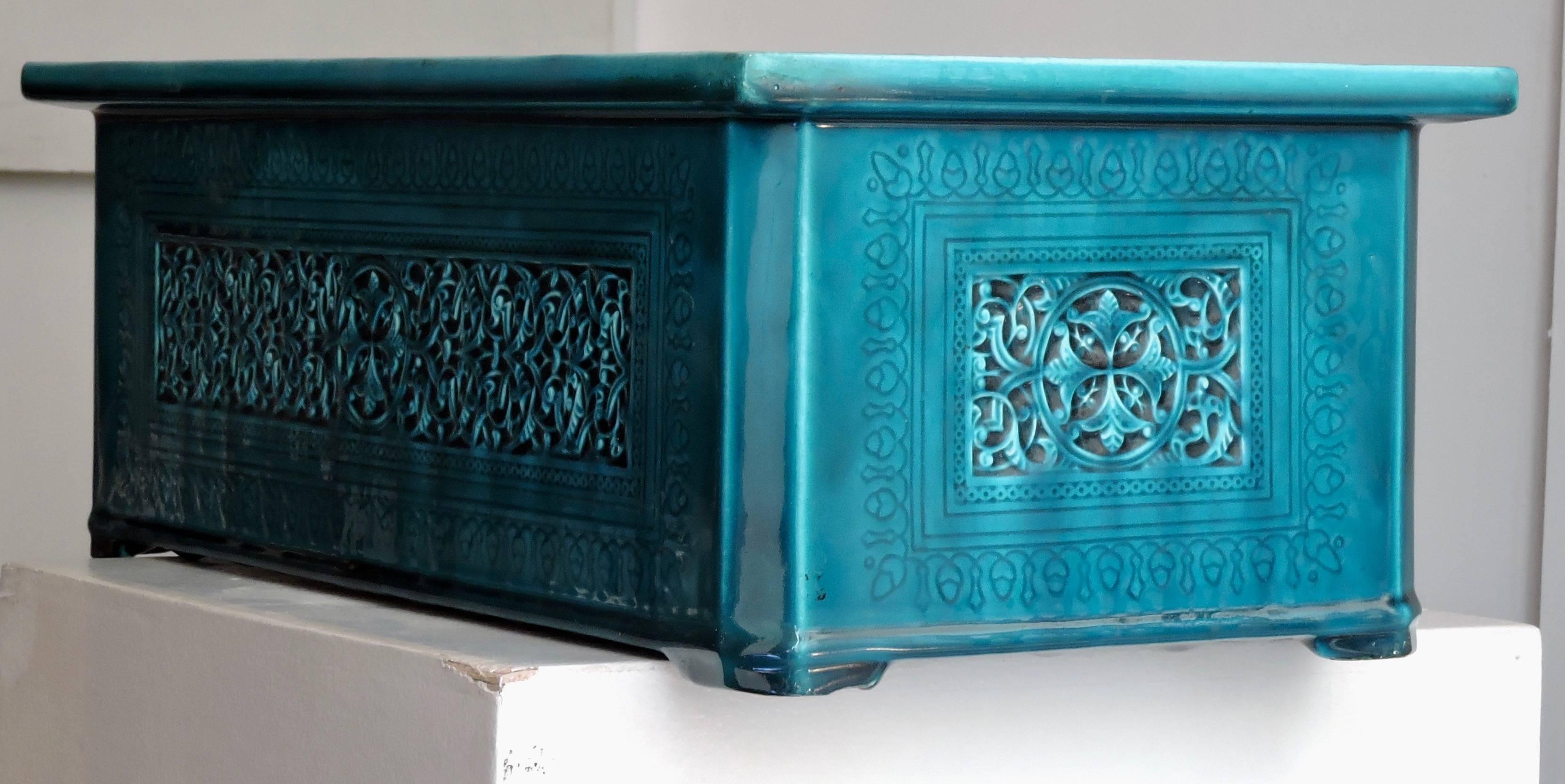 A Rectangular Théodore Deck blue-Persian faience cachepot in the Islamic style, modelled in low relief and incised with interlacing and rosette pattern.
With original zinc planter receiver
Signed TH.DECK in Hollow.