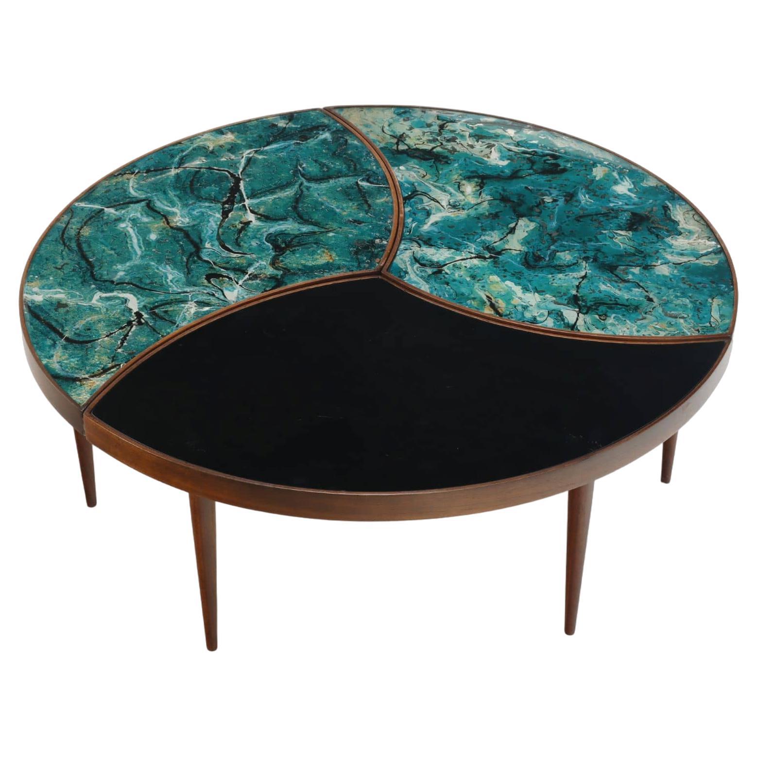 A three-part biomorphic marbleized glass and walnut circular coffee table. For Sale