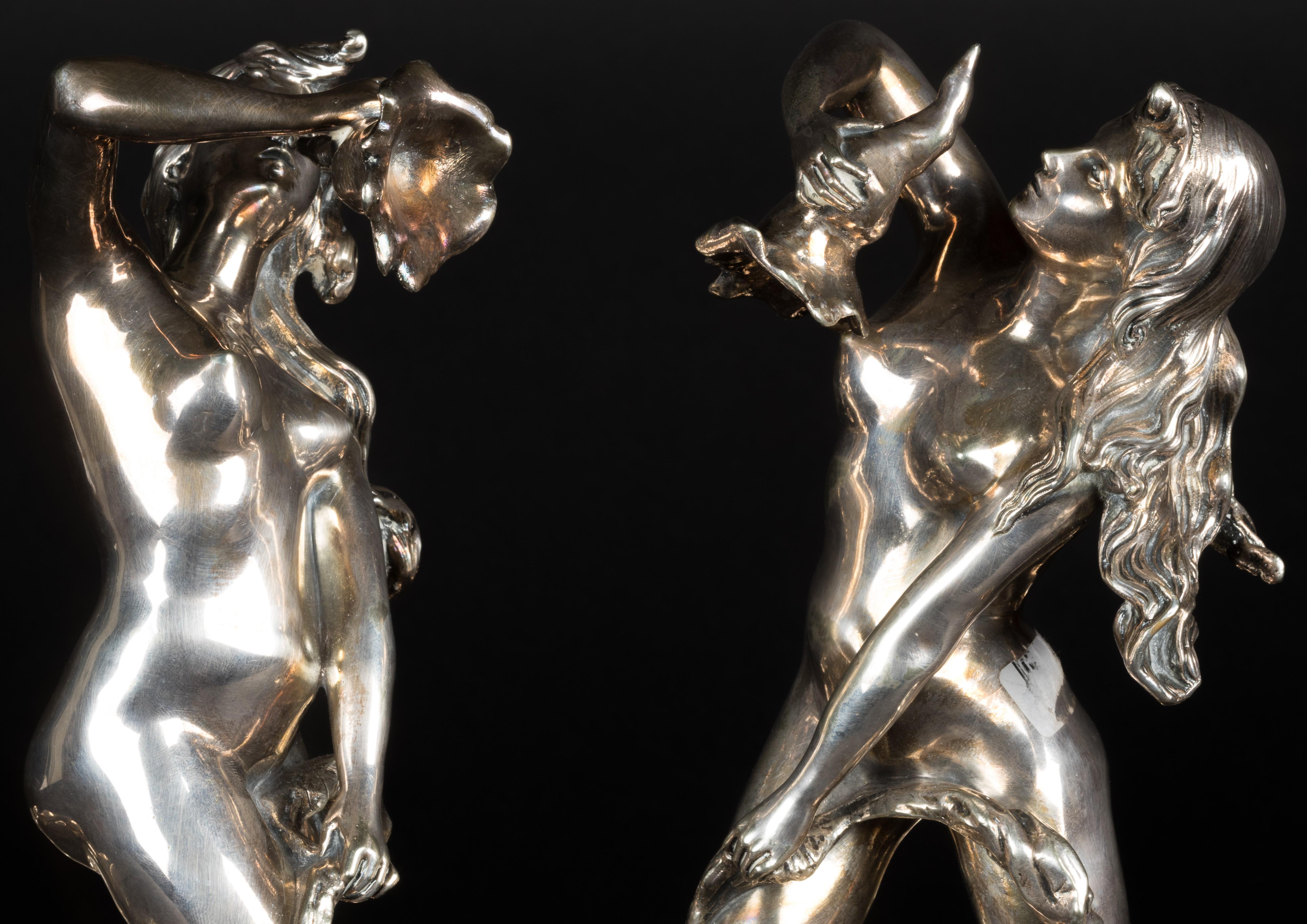 A three-part table piece by the maker Wiskemann. Probably made for the World Exhibition in Antwerp, 1930. 

The Orfèvrerie Wiskemann:

Otto-Léonard Wiskemann (1852–1909) set up in business in the heart of Brussels in 1872 and specialized in